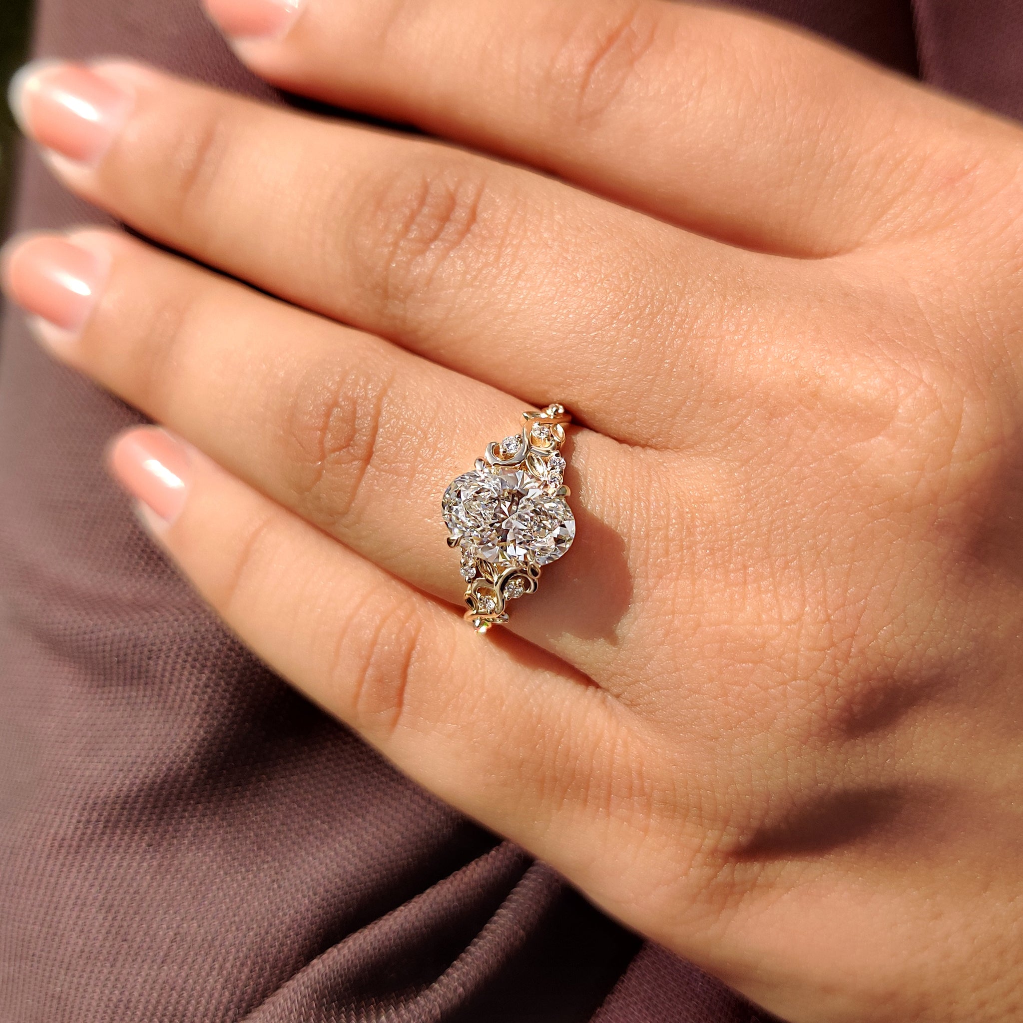 Diamond engagement ring with round side stone.
