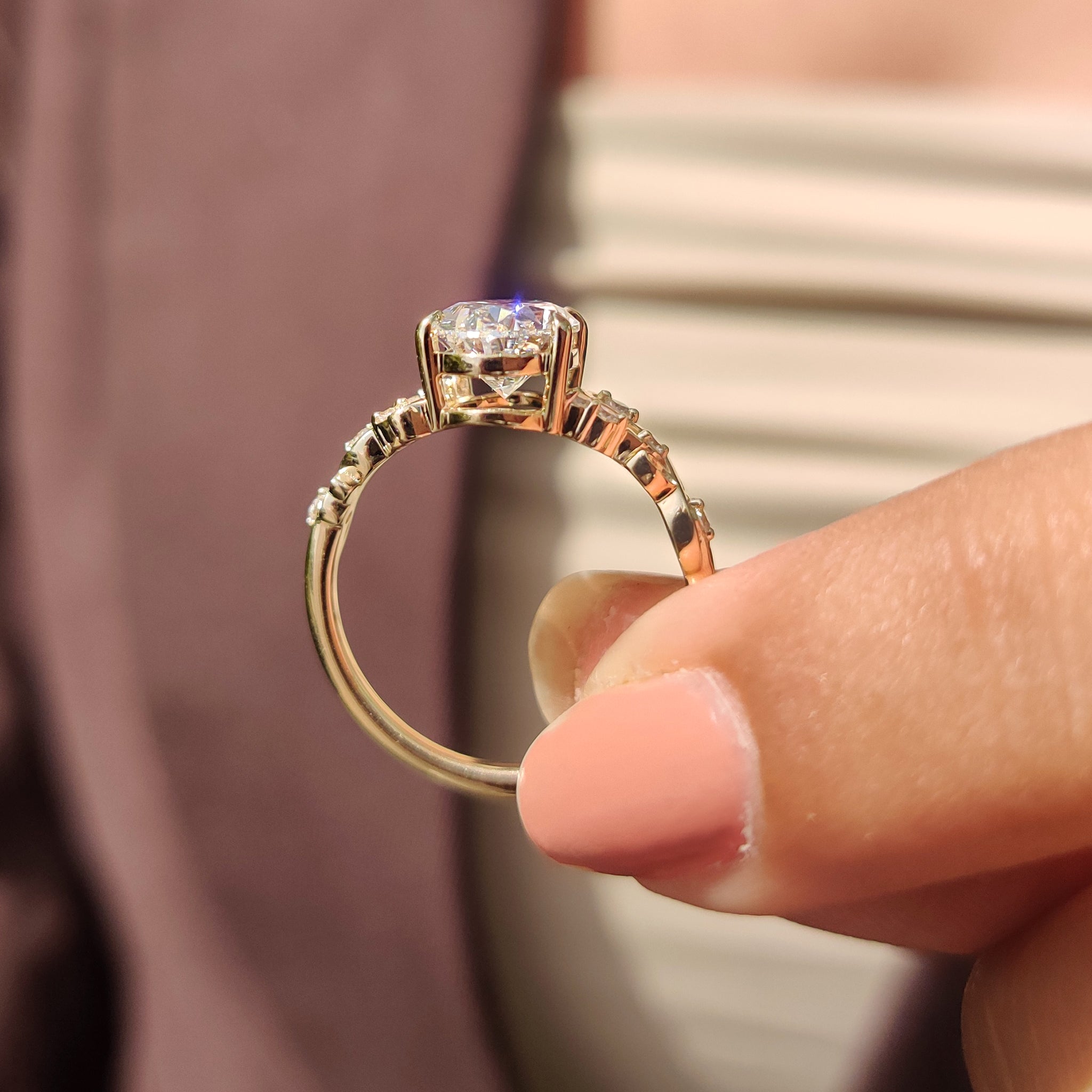 Yellow gold diamond ring in oval shaped engagement ring.
