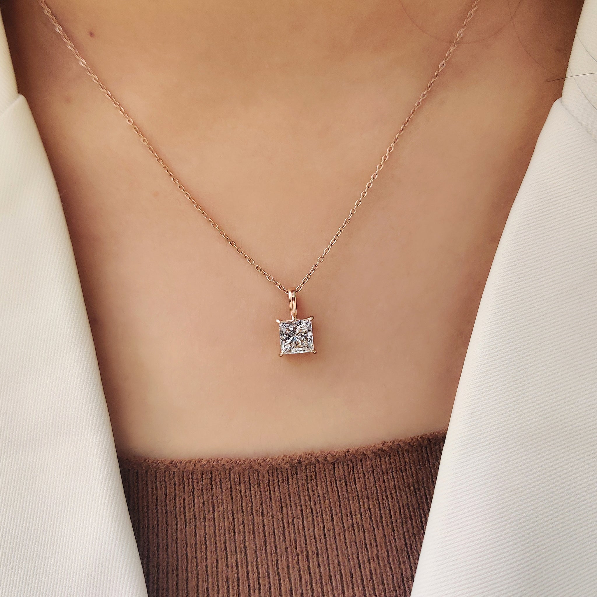 Princess cut diamond pendant with solitaire pendant.
