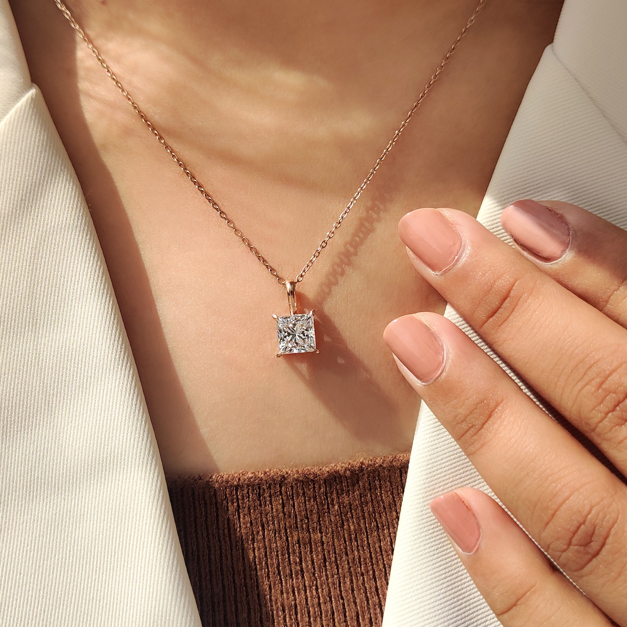 Carat Diamonds pendant with princess cut diamond pendant.
