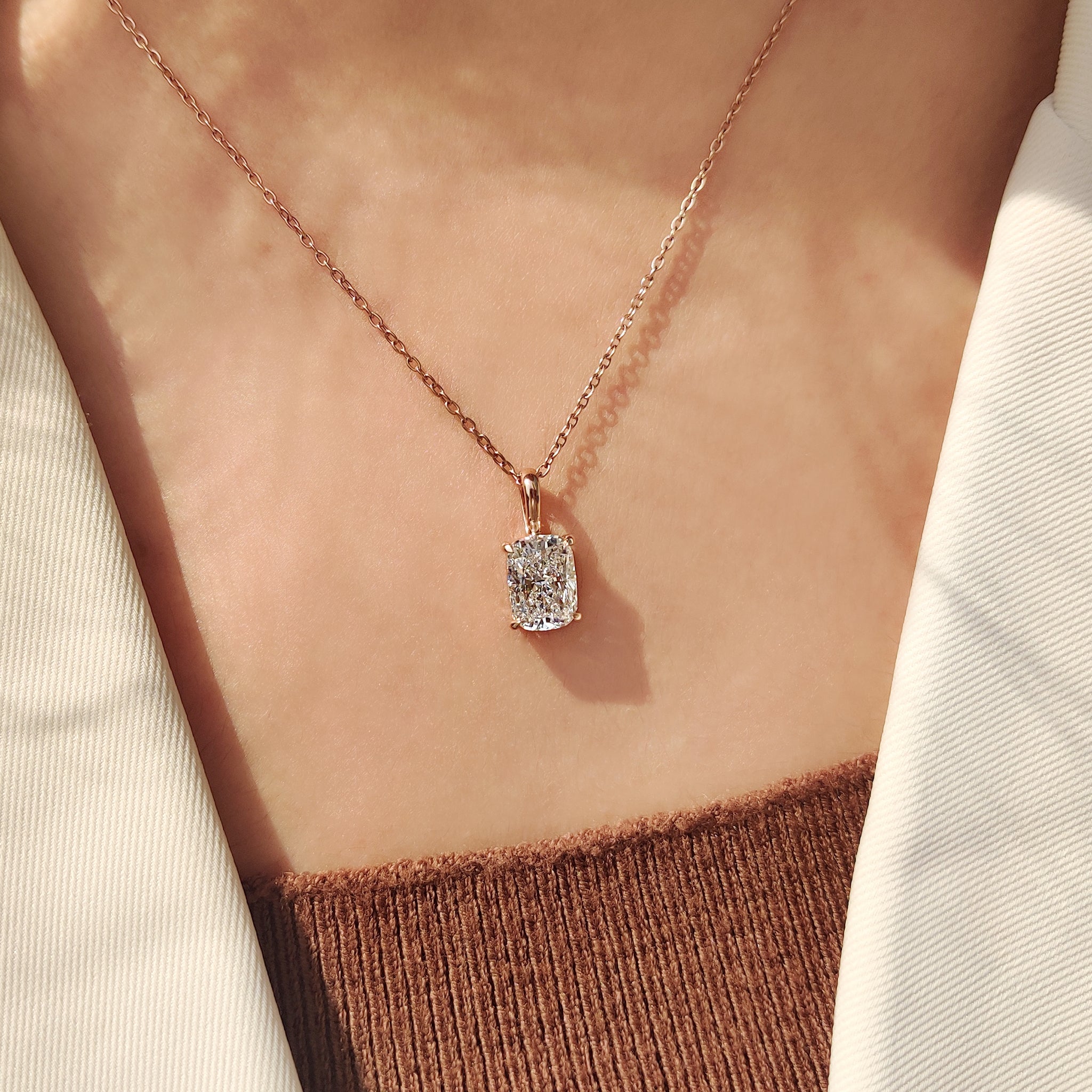 Solitaire diamond pendant with cushion cut diamond pendant.
