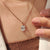 Cushion solitaire pendant with diamond pendant.
