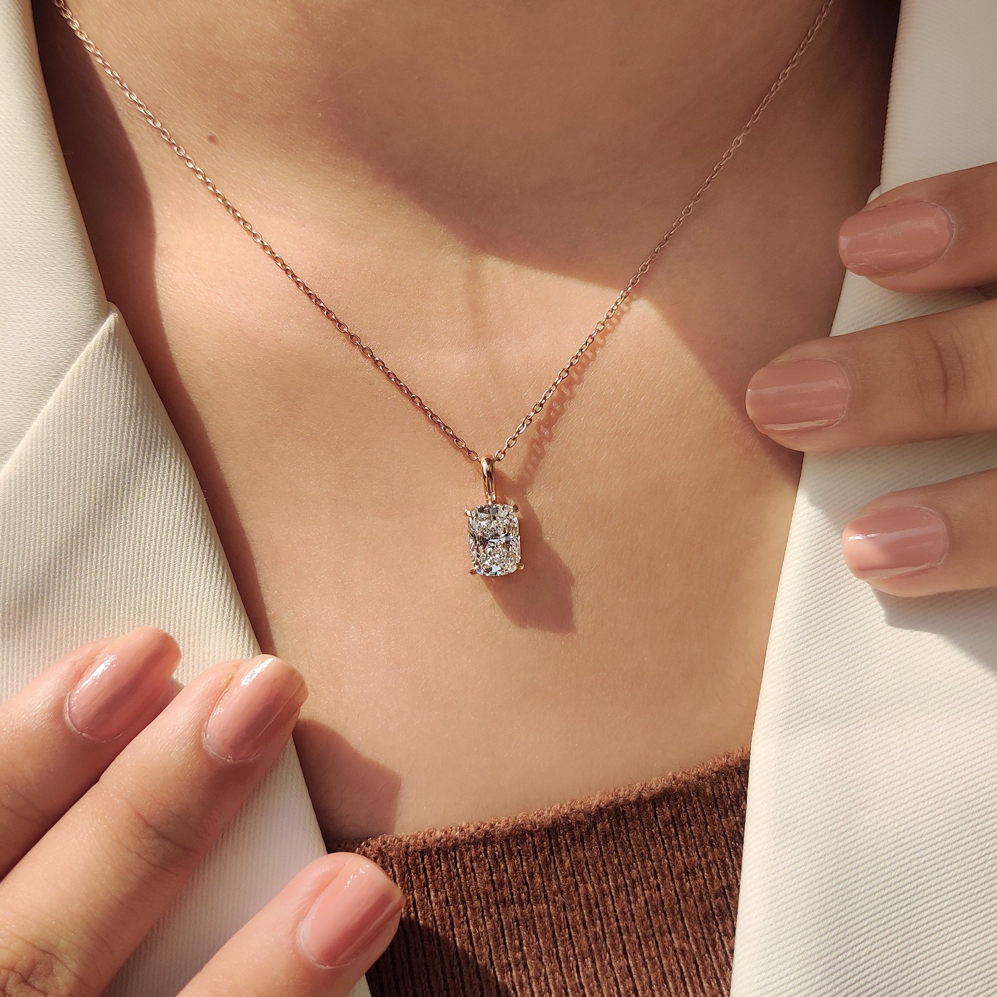 Carat Diamonds pendant with cushion cut diamond pendant.
