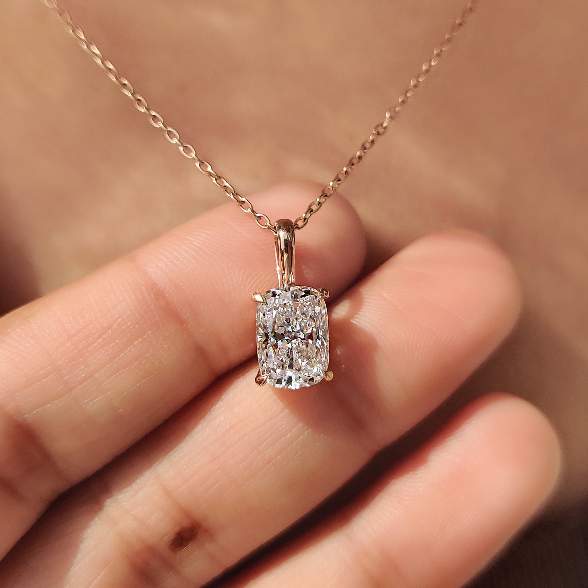 Diamond pendant with 4 claw prong setting.
