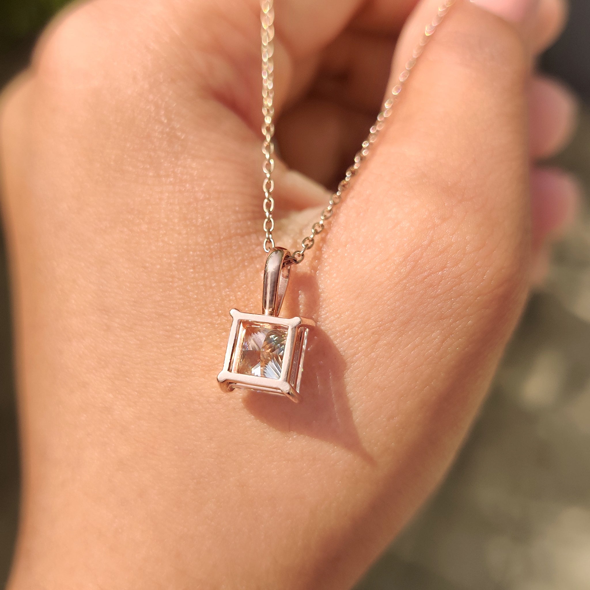 Unique diamond pendant in princess solitaire pendant.
