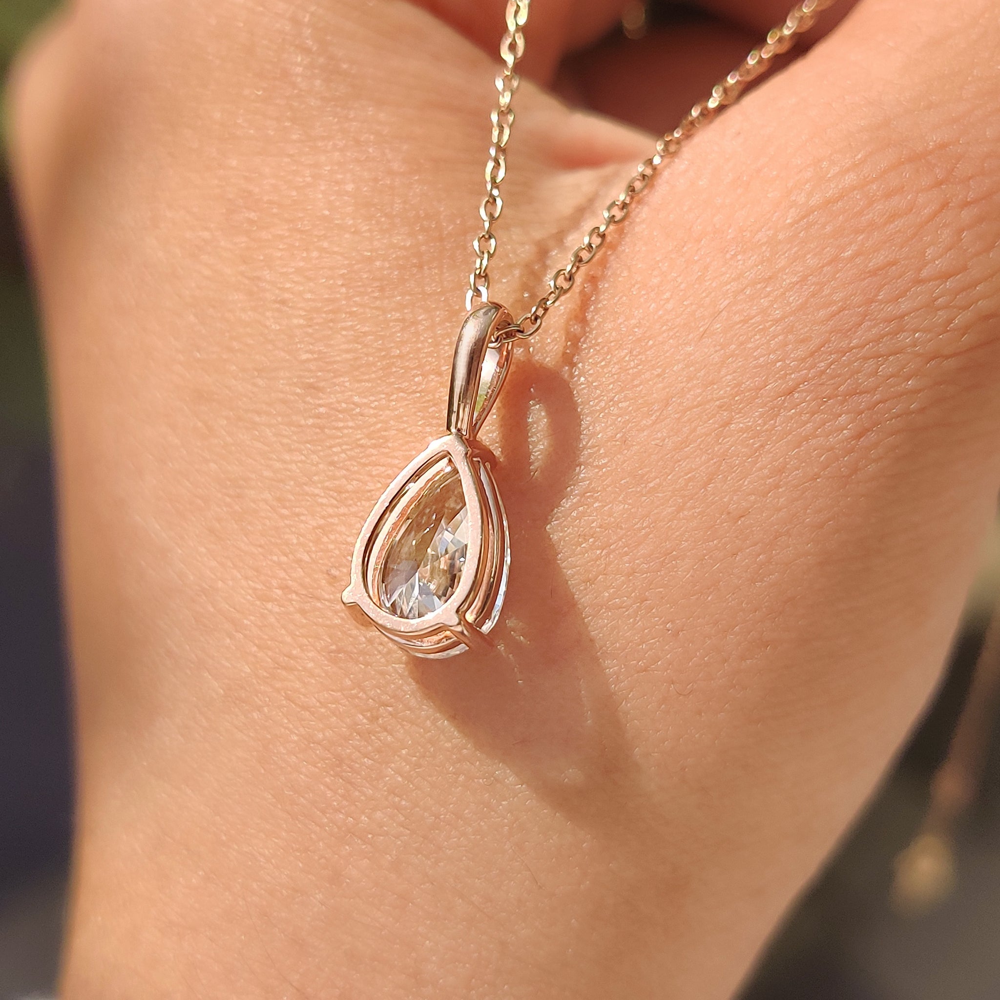 V prong setting with pear diamond pendant.
