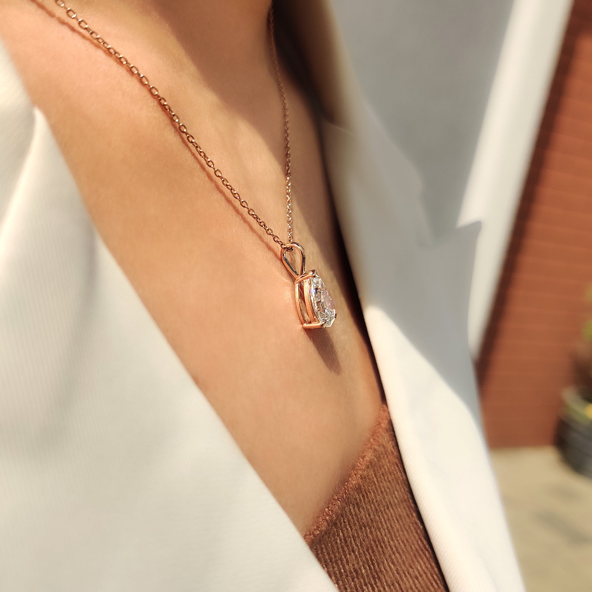 Carat Diamonds pendant with pear diamond pendant.
