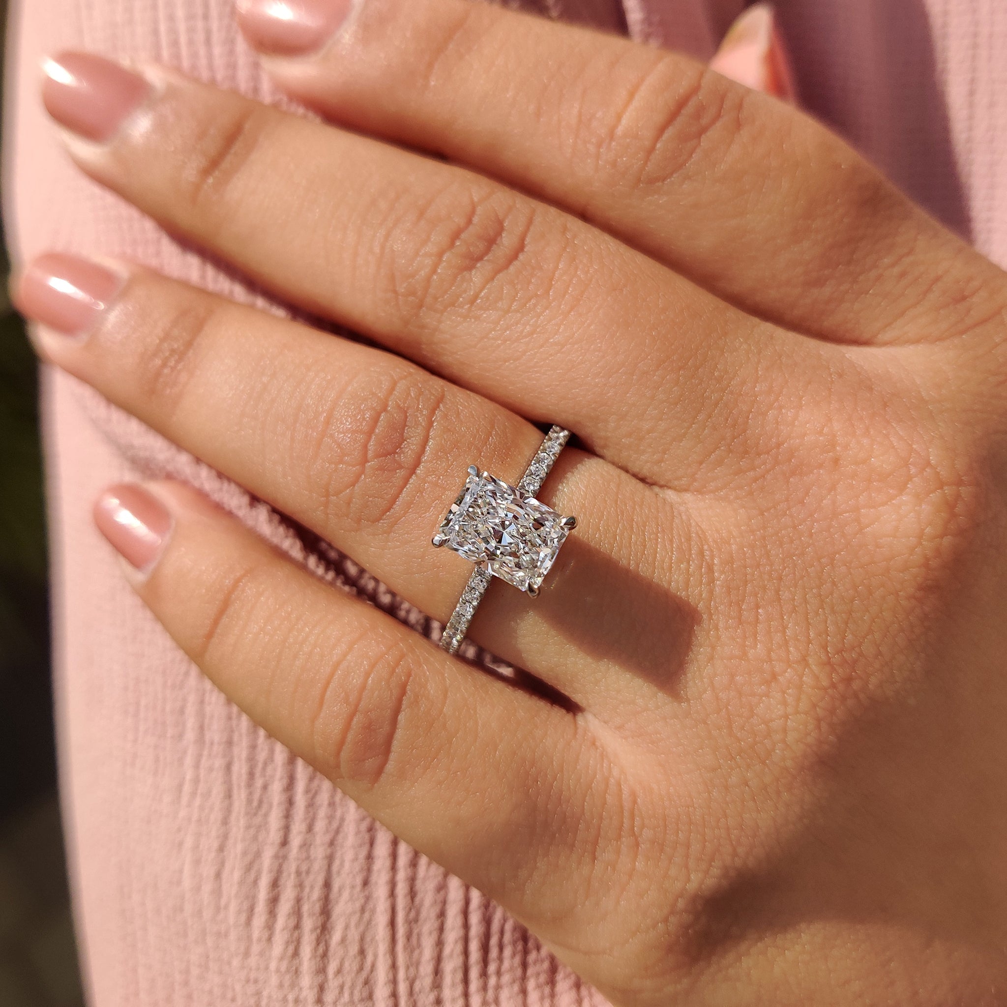 Hidden halo engagement ring with white gold diamond ring look.
