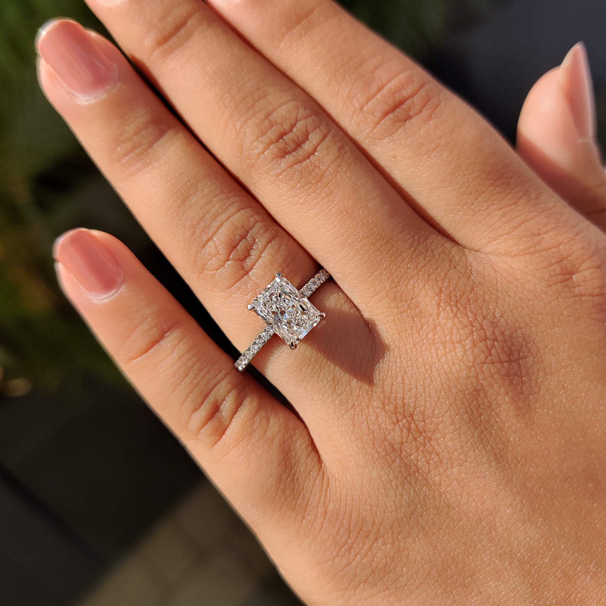 Cathedral setting engagement ring with hidden halo accent.
