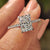 Radiant cut engagement ring with pave setting ring design.
