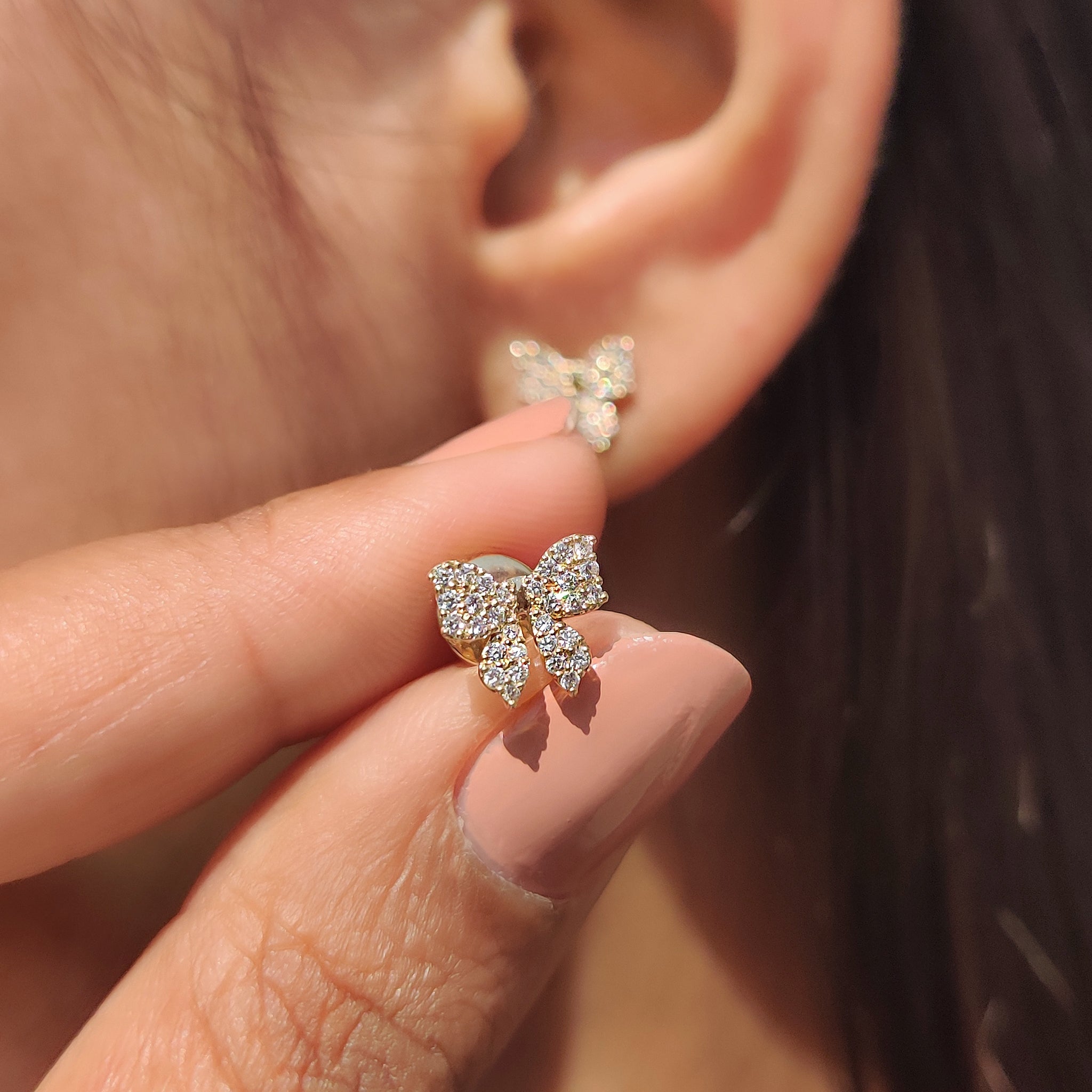 Carat Diamonds handmade gold bow earrings for women
