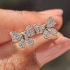 Gold bow earrings with round cut lab grown diamonds
