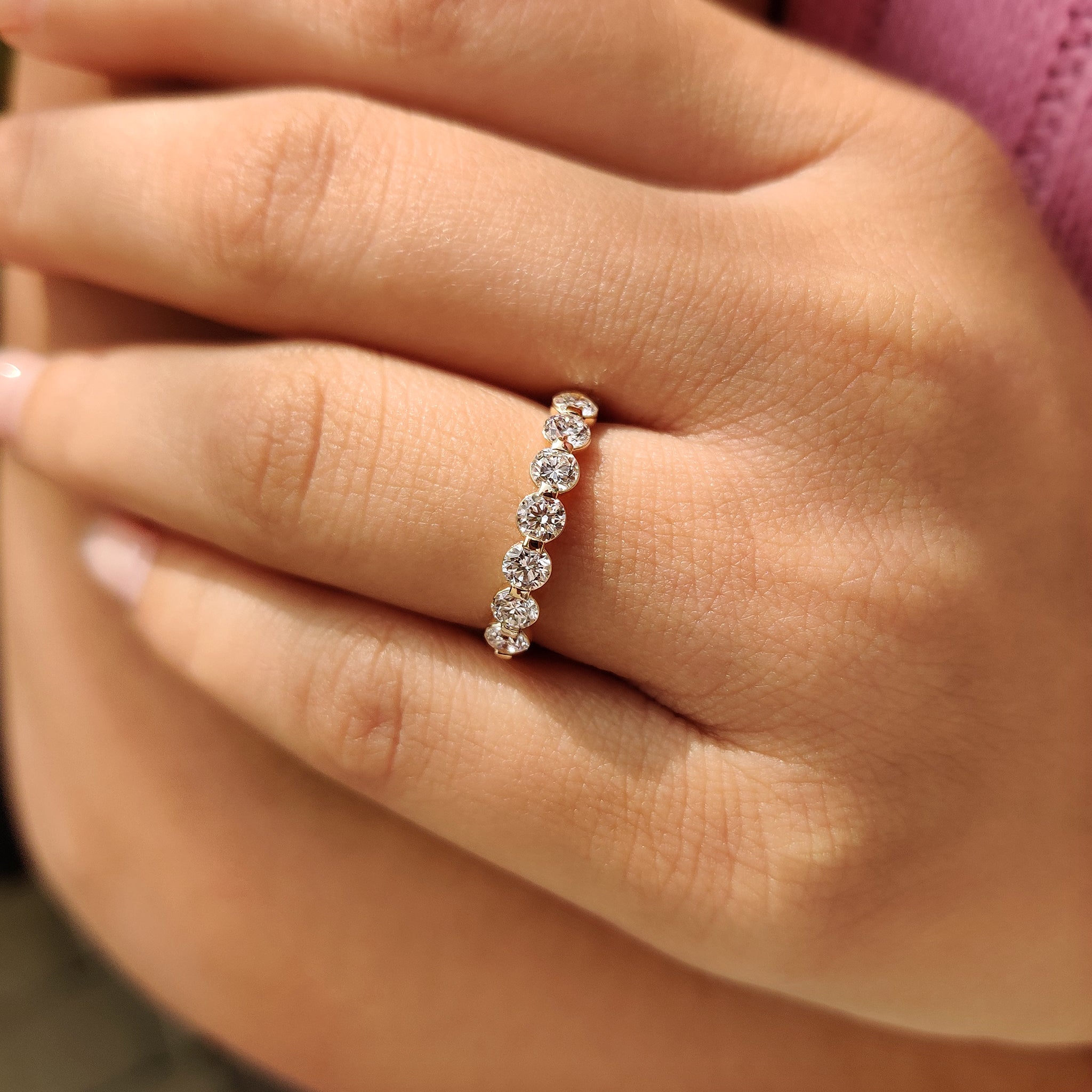 Yellow gold handmade half eternity wedding band with round diamonds.
