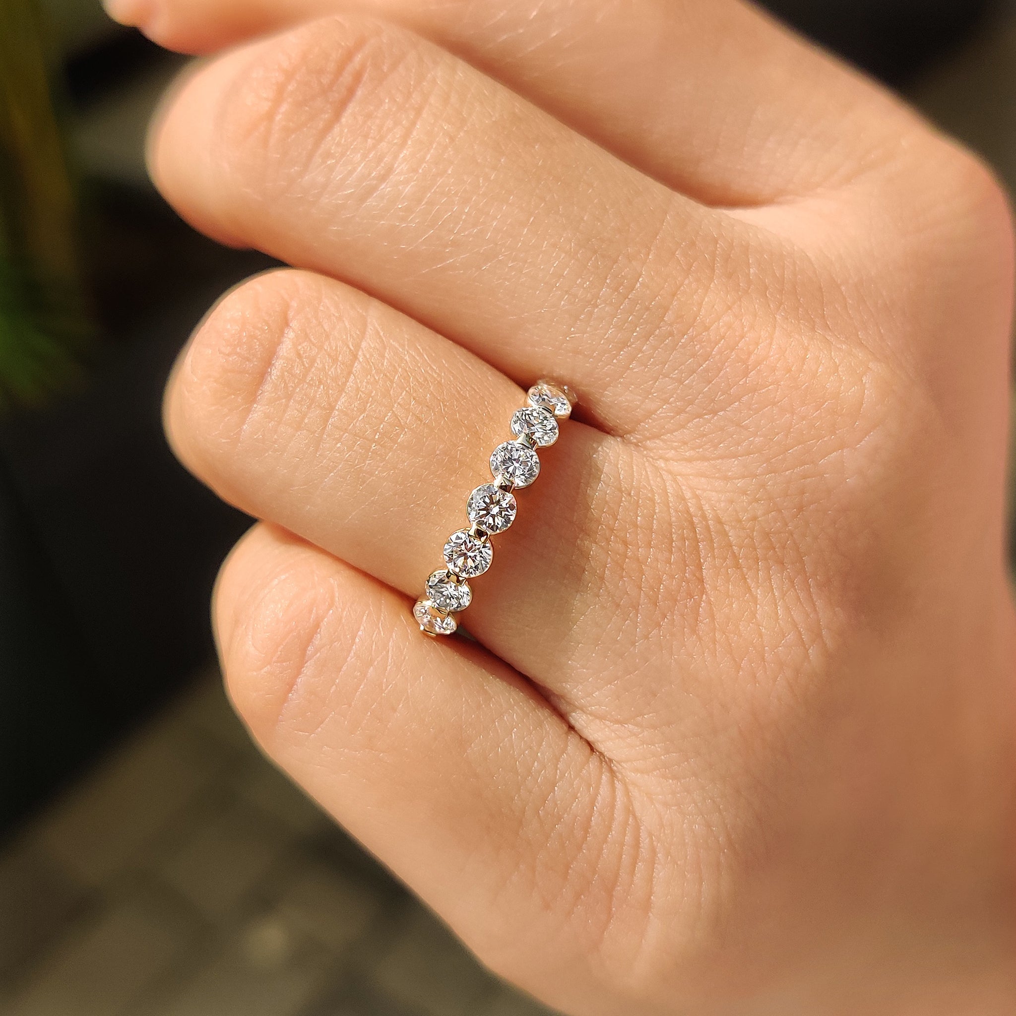 Handmade yellow gold shared prong wedding band for women.
