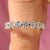 Shared prong half eternity diamond wedding band in yellow gold.
