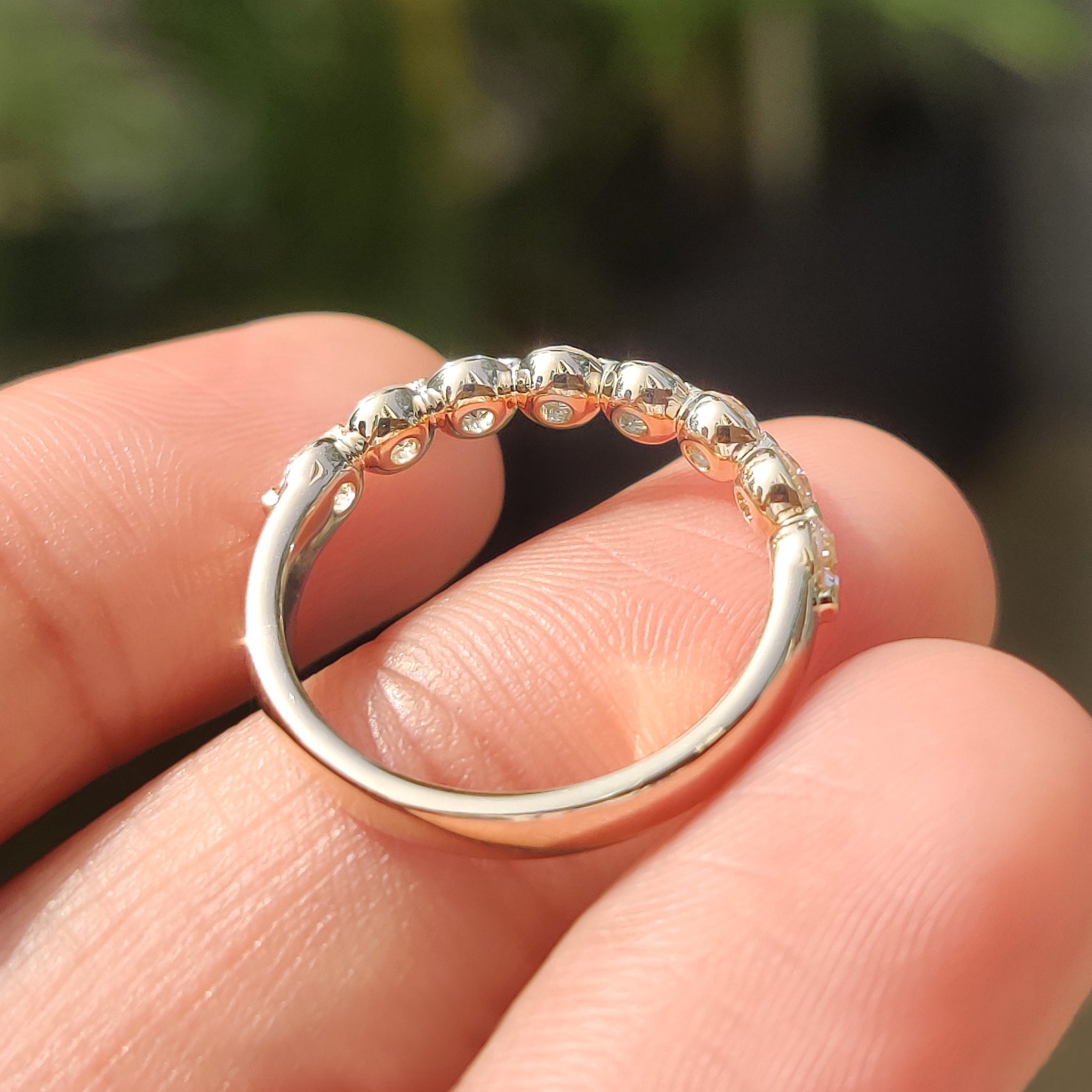 Yellow gold shared prong diamond band perfect for stacking.
