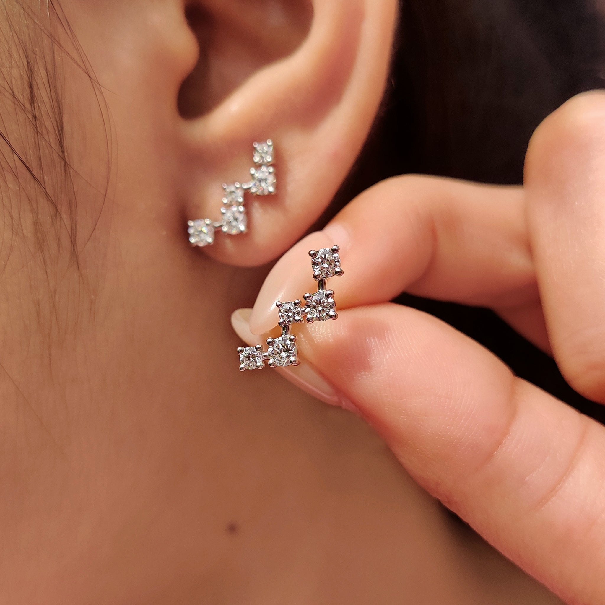 Carat diamonds earrings with classic round cut and secure screw back
