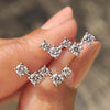 Round diamond stud earrings with white gold setting and screw back design

