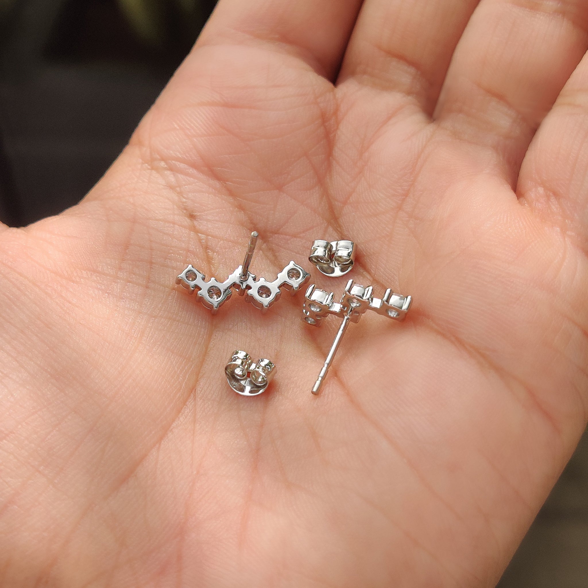 Round diamond earrings with screw back and carat diamond detailing
