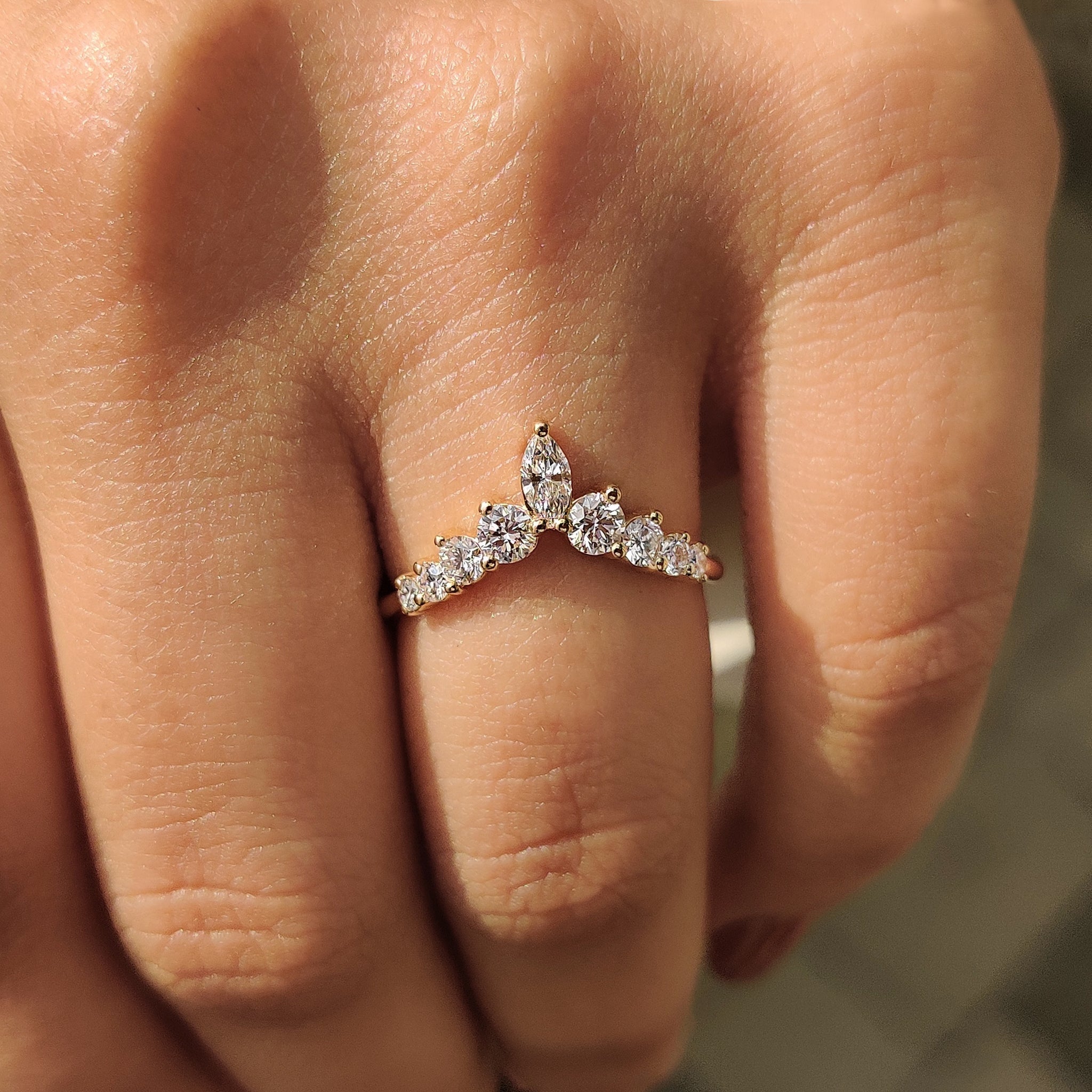 Yellow gold wedding band with seven stone arrangement and Lab Grown Diamond
