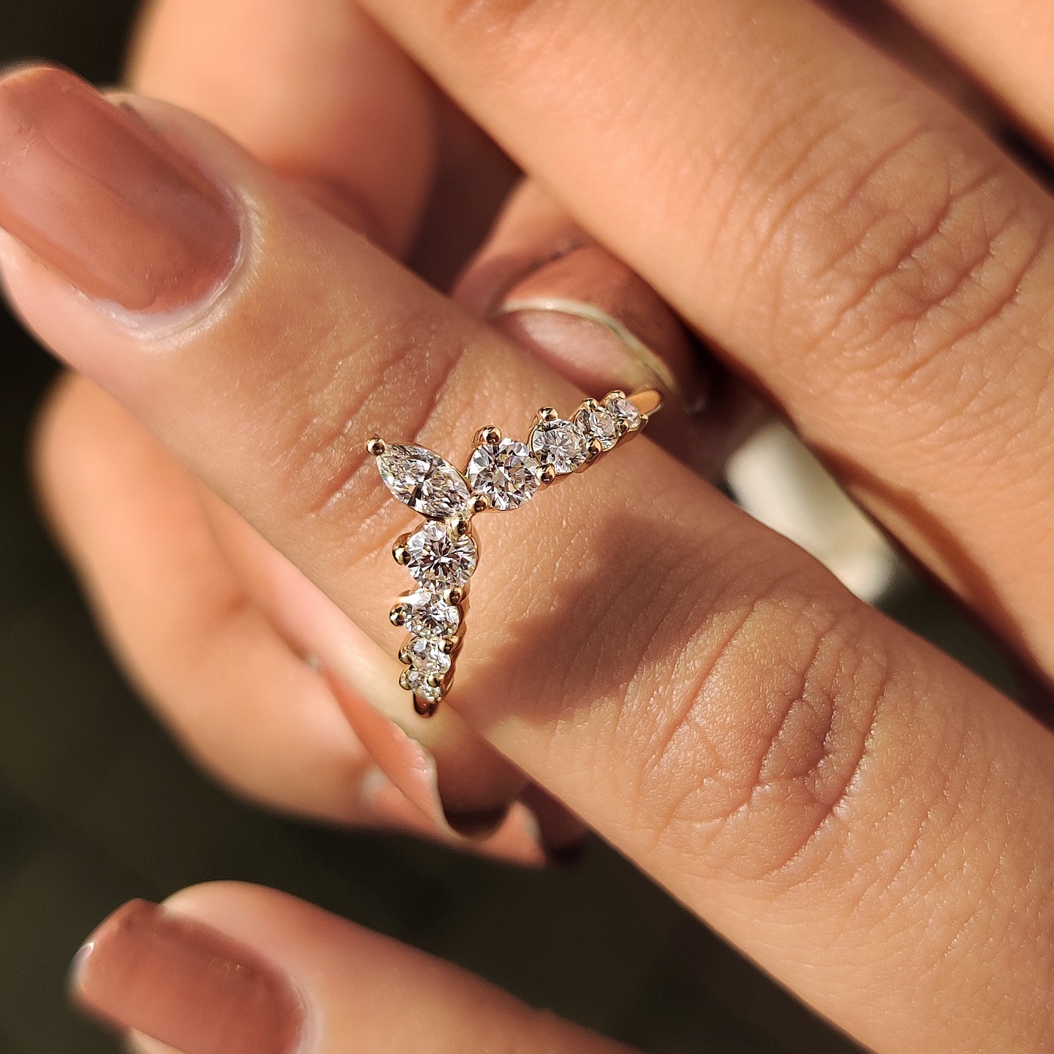 Curved wedding band with carat diamonds and handmade jewelry craftsmanship
