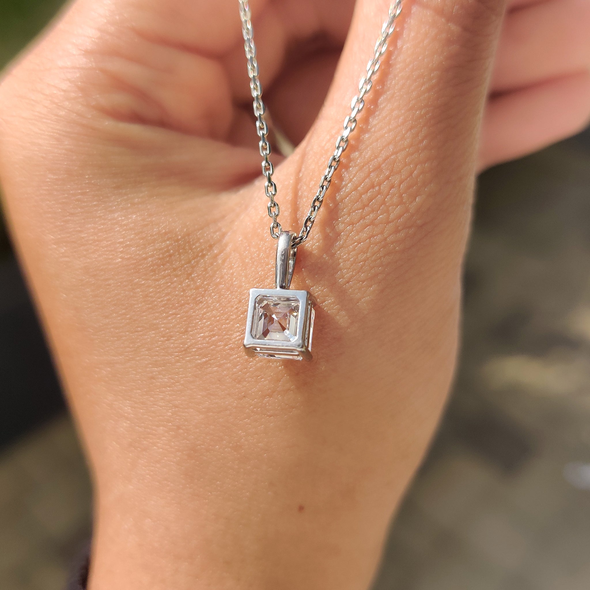 Asscher cut solitaire diamond pendant crafted by Carat Diamonds
