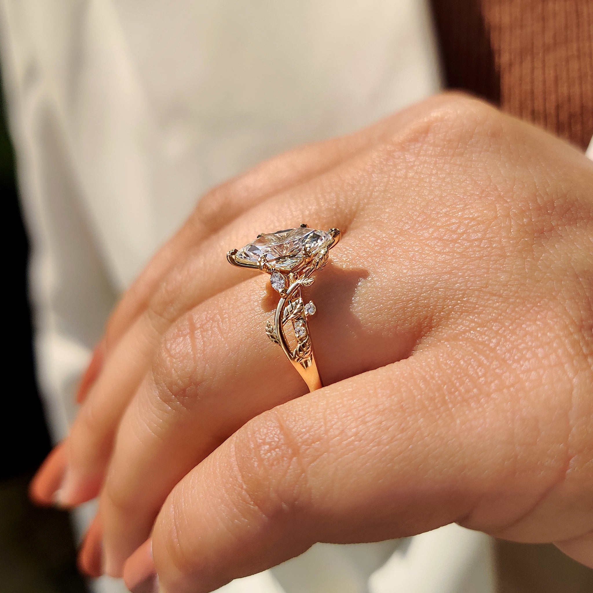 Leaf style prong in yellow gold engagement ring.