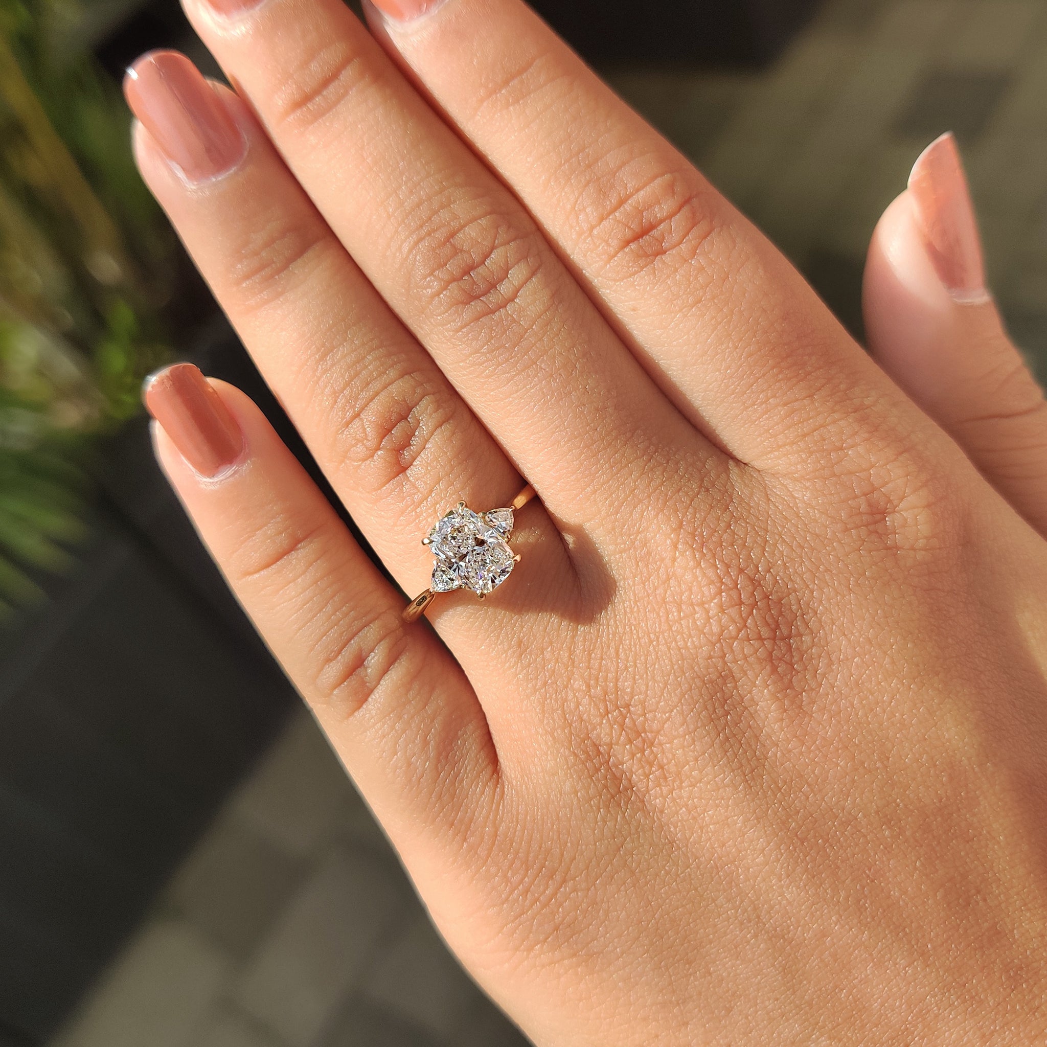 Custom engagement ring with lab grown elongated cushion cut diamond.
