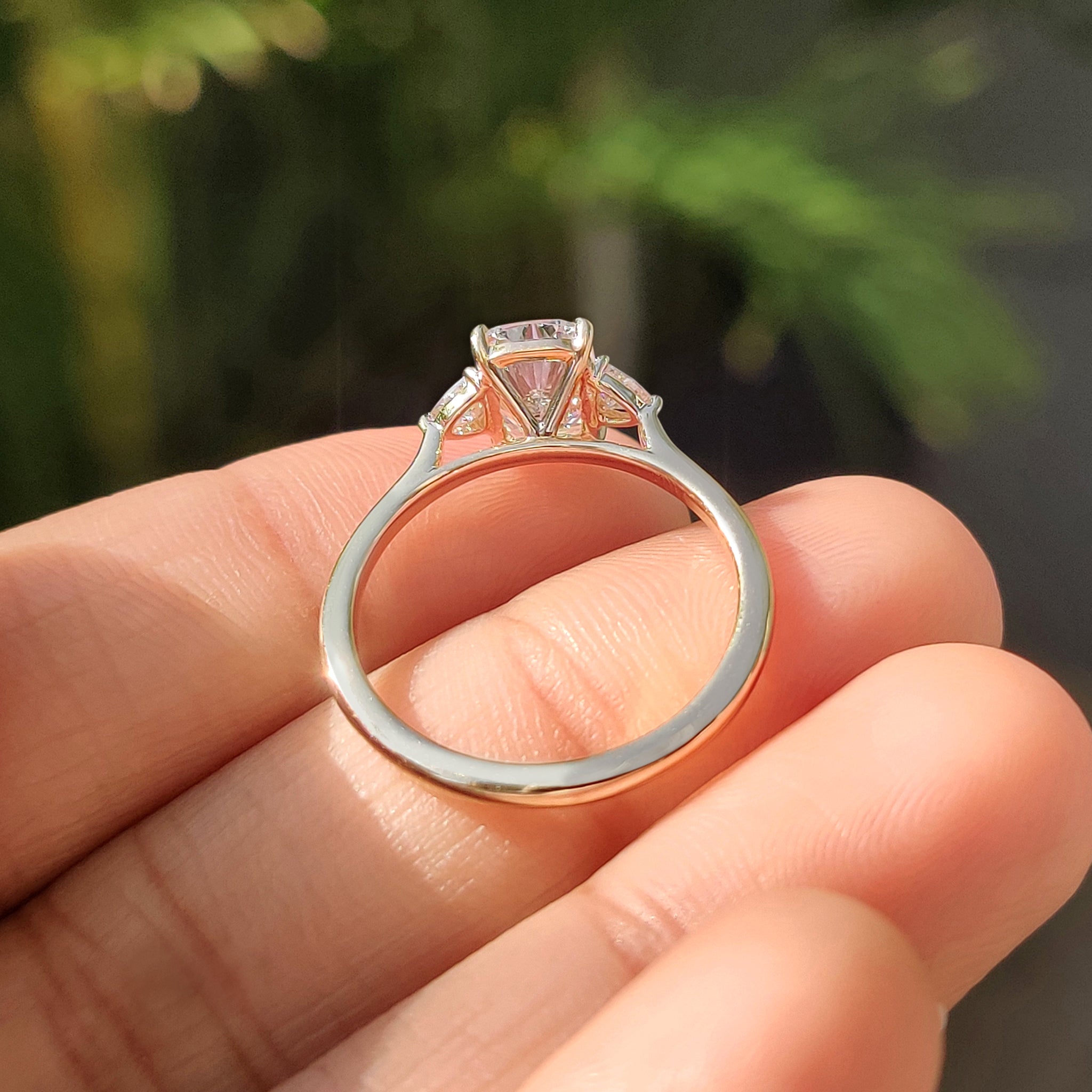 Handmade ring with elongated cushion cut diamond and tapered shank band.
