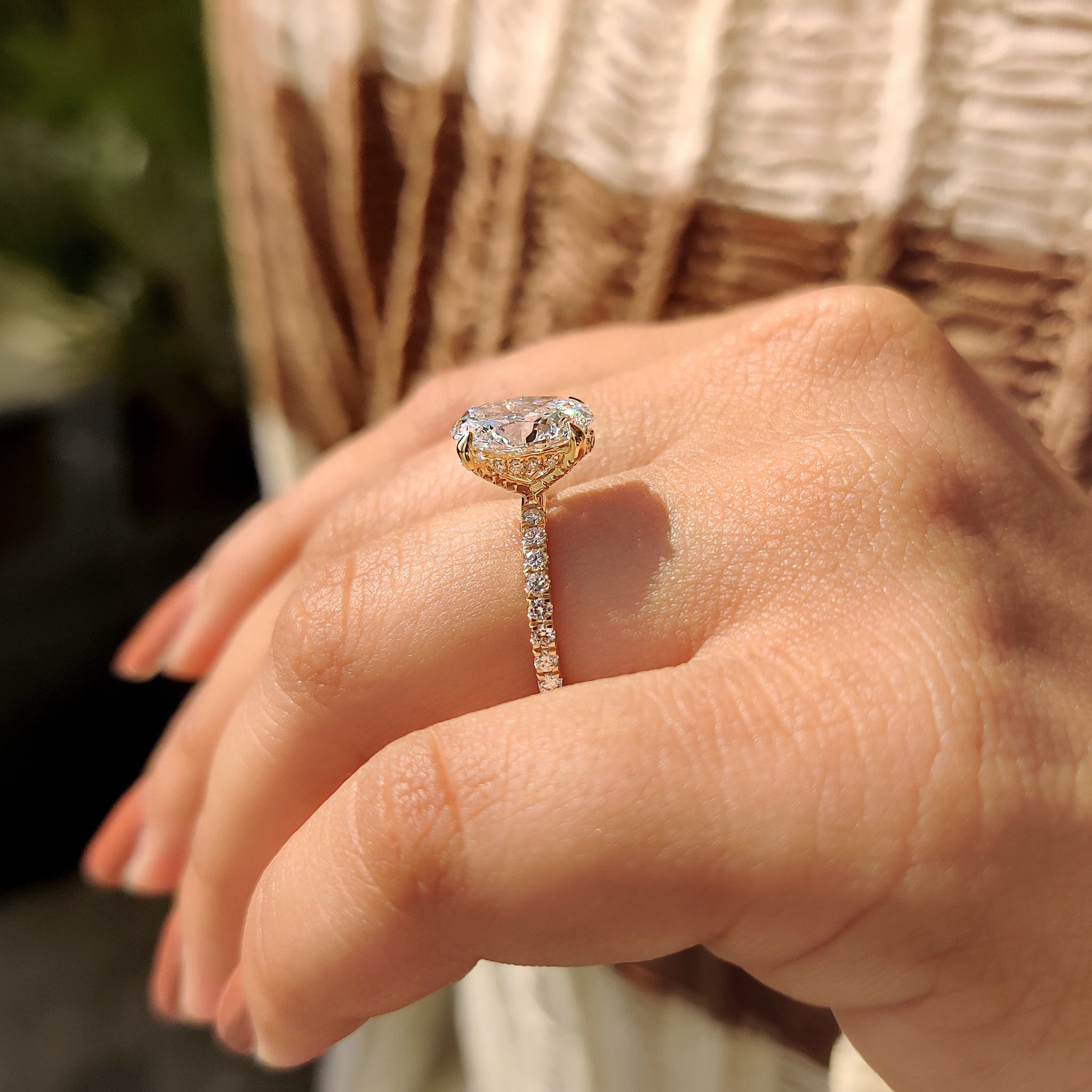 Buy diamond ring with lab grown oval diamond and hidden halo design.
