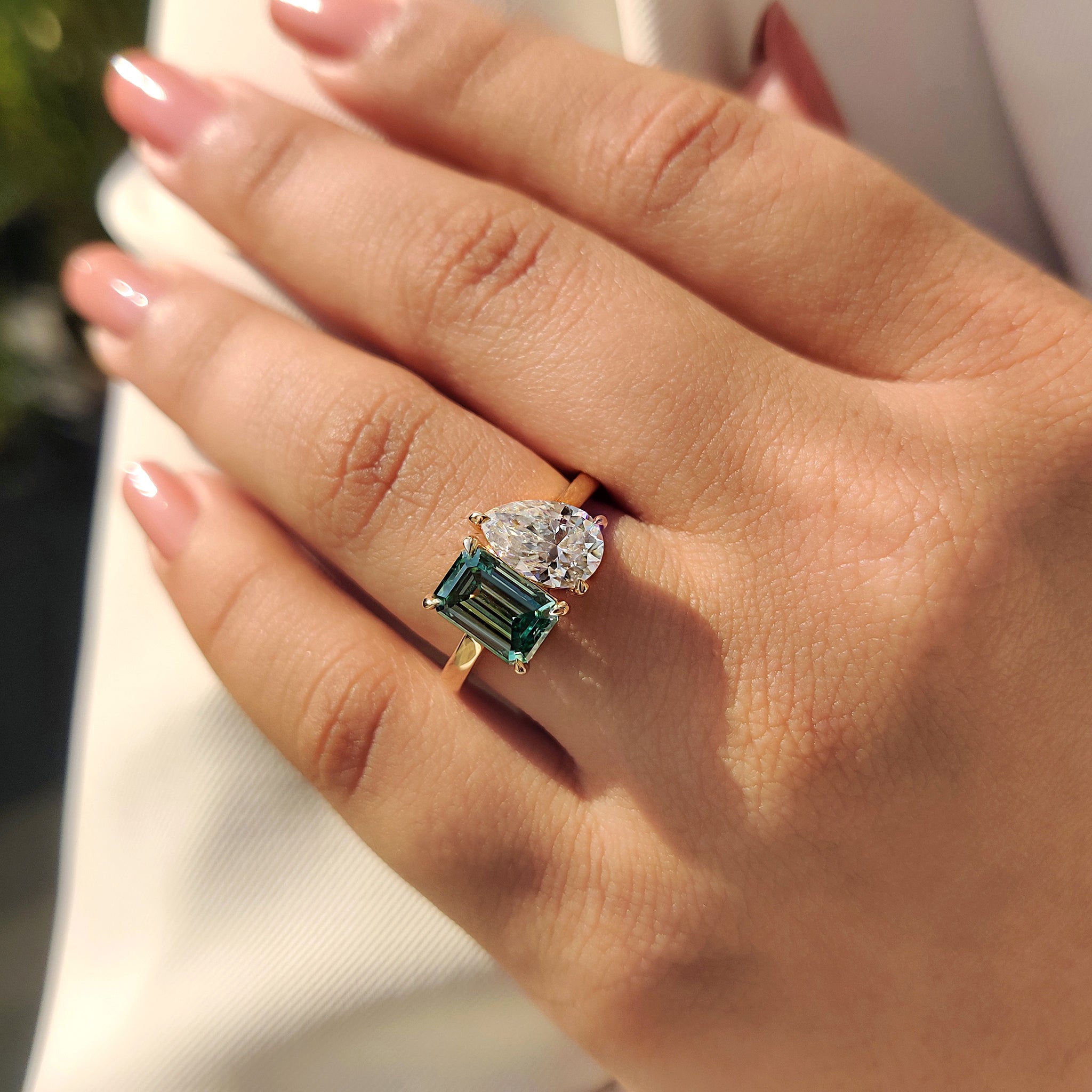 Handmade ring with green emerald and pear cut stones, Toi Et Moi design.