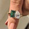 Toi Et Moi engagement ring in yellow gold with pear and emerald cut stones.
