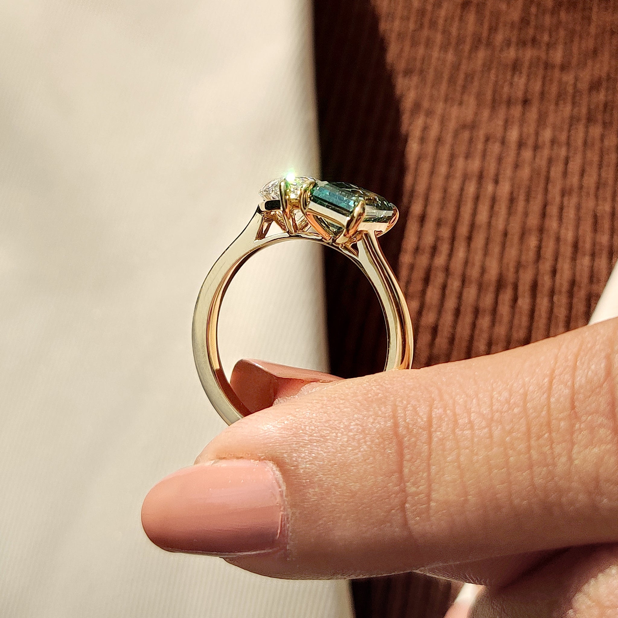 Two stone engagement ring with claw prong and cathedral setting in yellow gold.