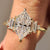 Dutch Marquise moissanite ring in yellow gold with five stone design and six claw prong setting.
