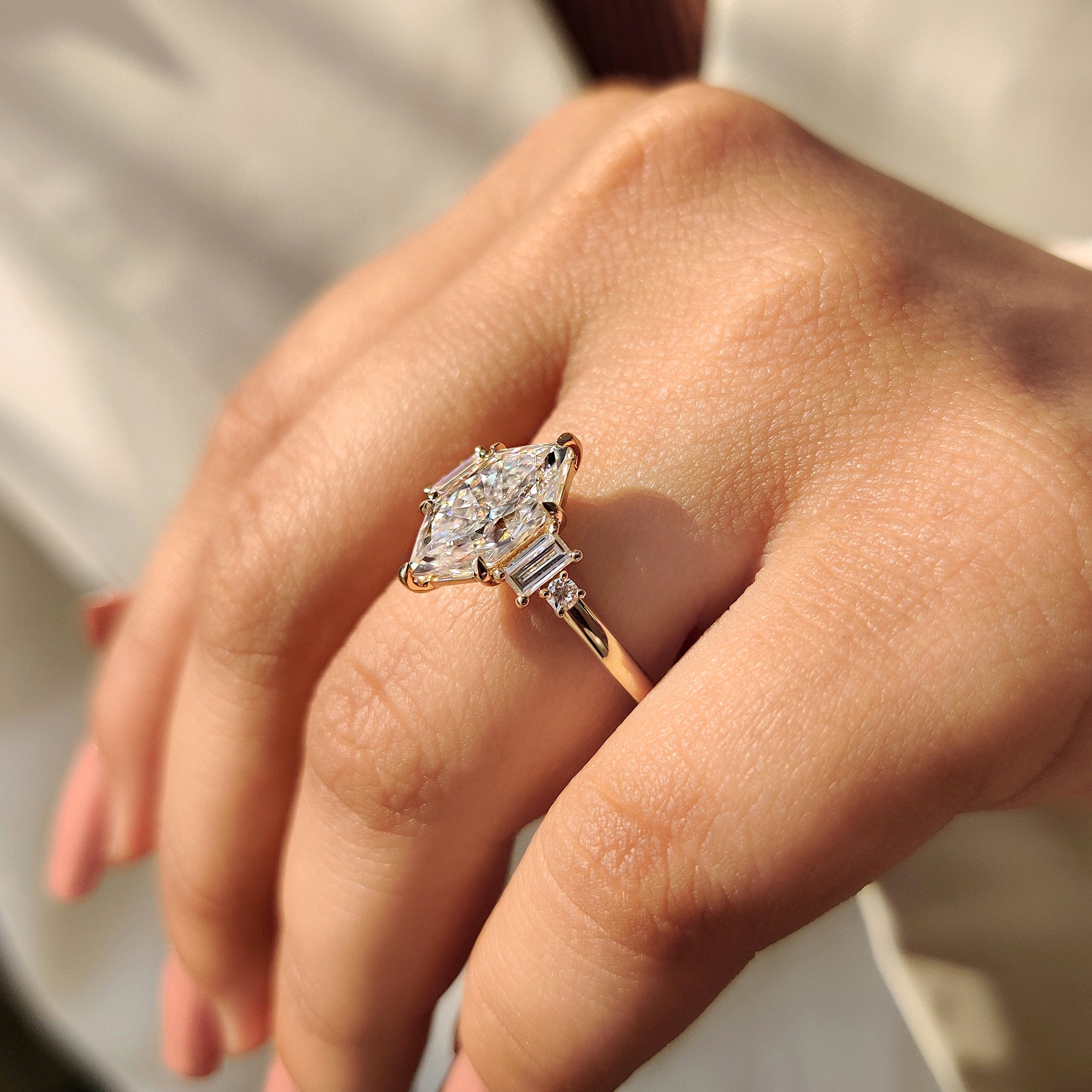 Handmade jewelry ring with Dutch Marquise moissanite and baguette side stones.

