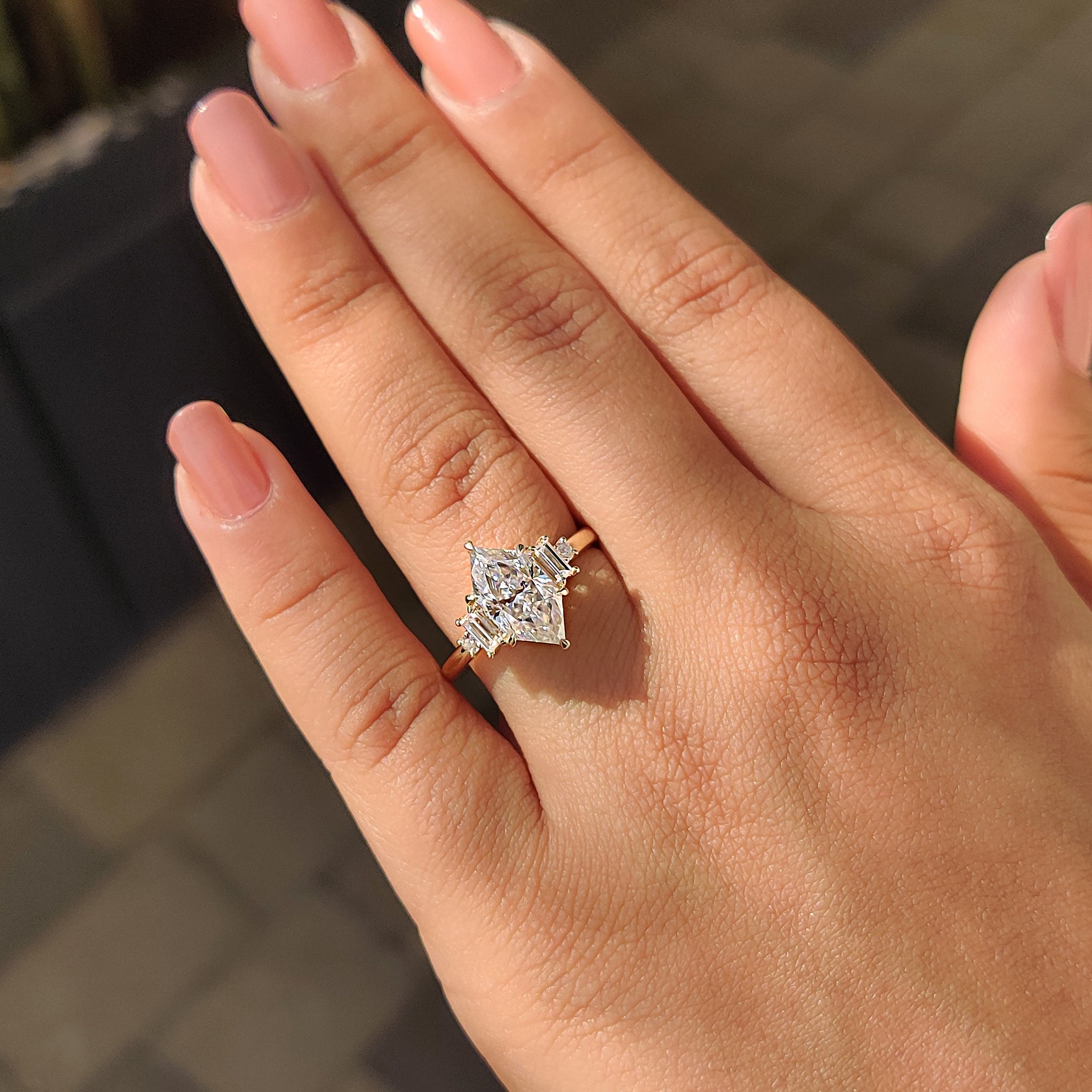 Handmade ring with Dutch Marquise moissanite and round cut baguette stones.
