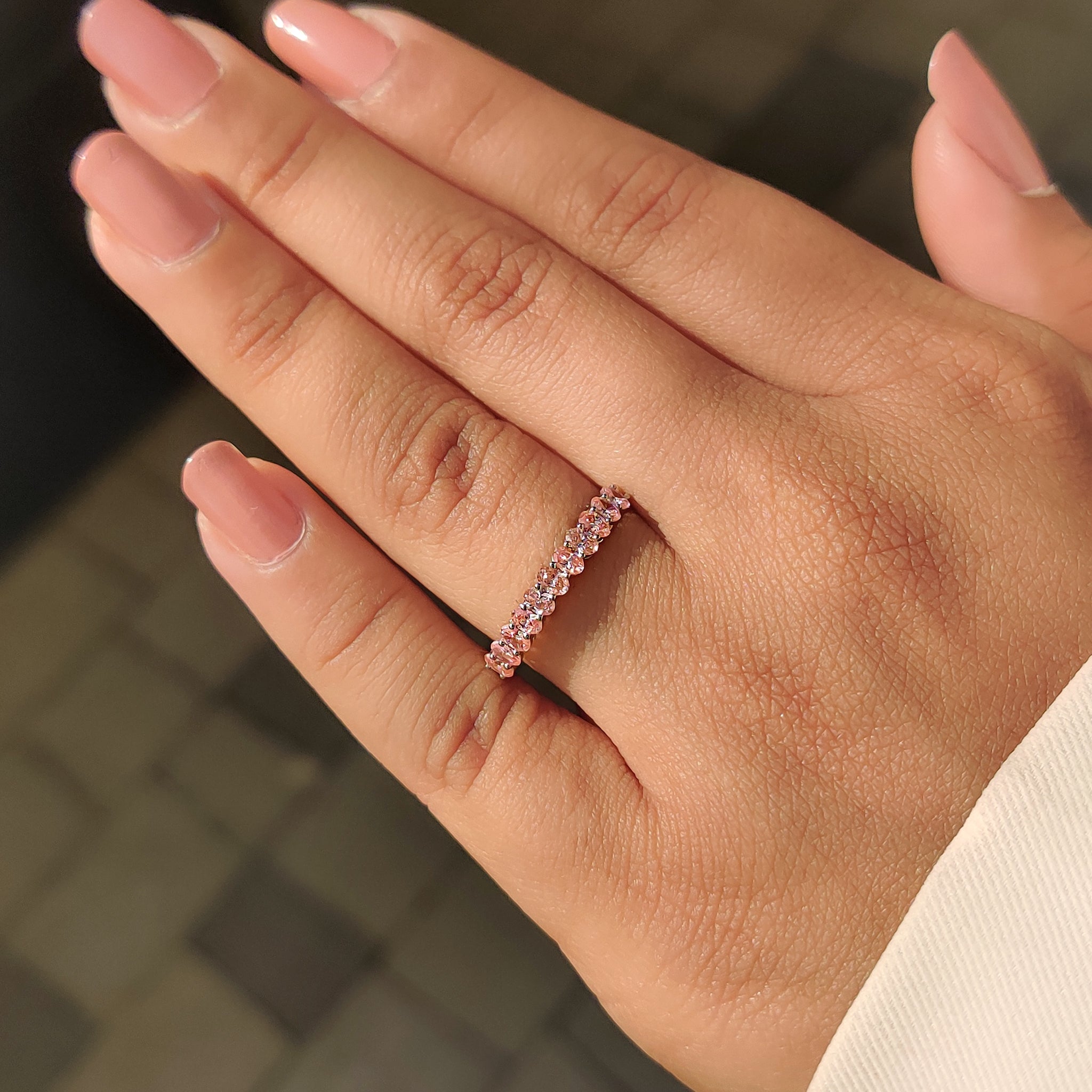 Buy wedding band with lab grown pink diamond and shared prong setting in white gold.