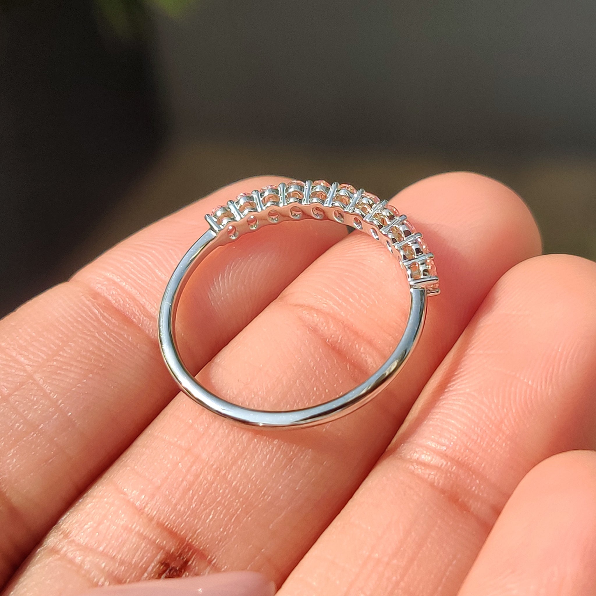 Pink diamond wedding band with white gold band and handmade jewelry design.
