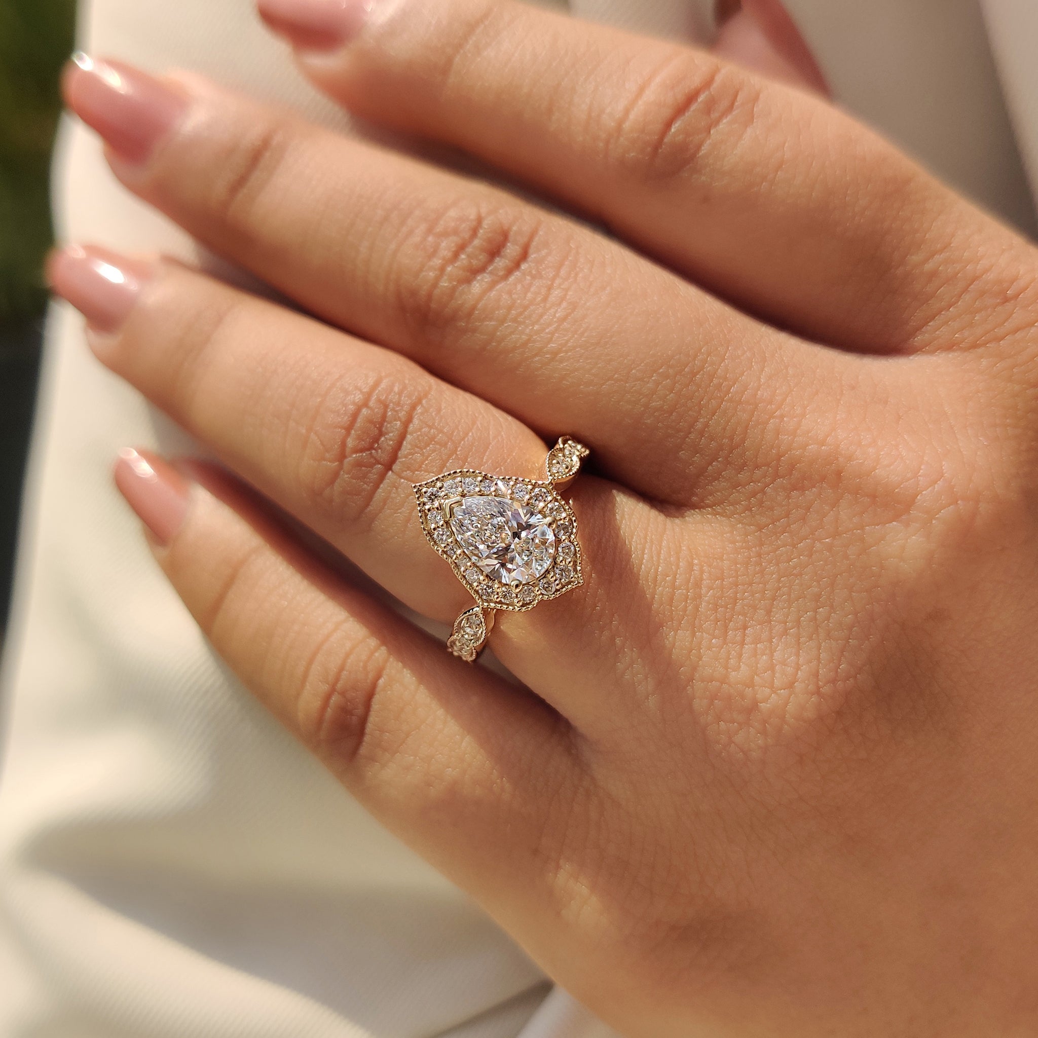 Custom engagement ring with lab grown pear cut diamond and IGI certified.