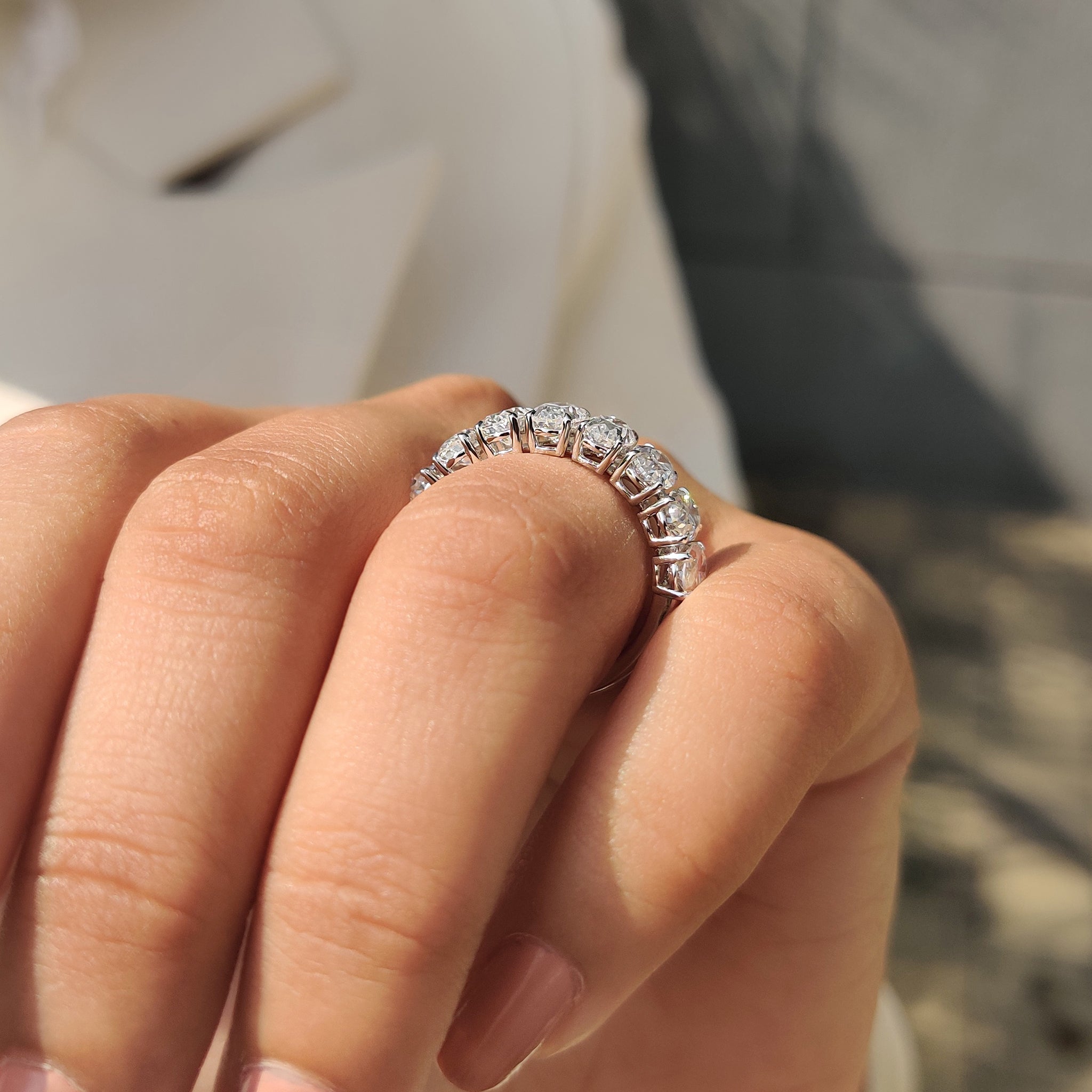 Handmade band with oval cut Moissanite and half eternity design.
