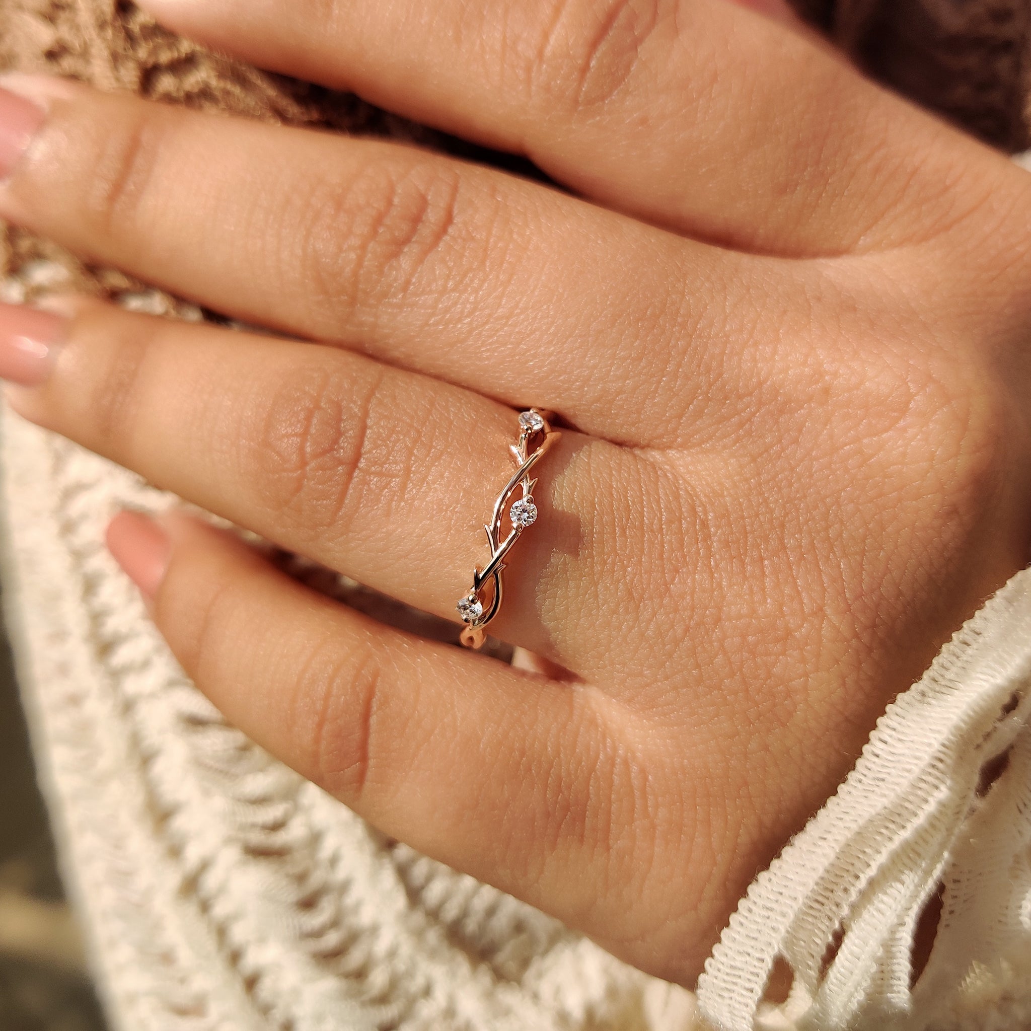Rose gold wedding band with twisted shank and handmade jewelry craftsmanship.
