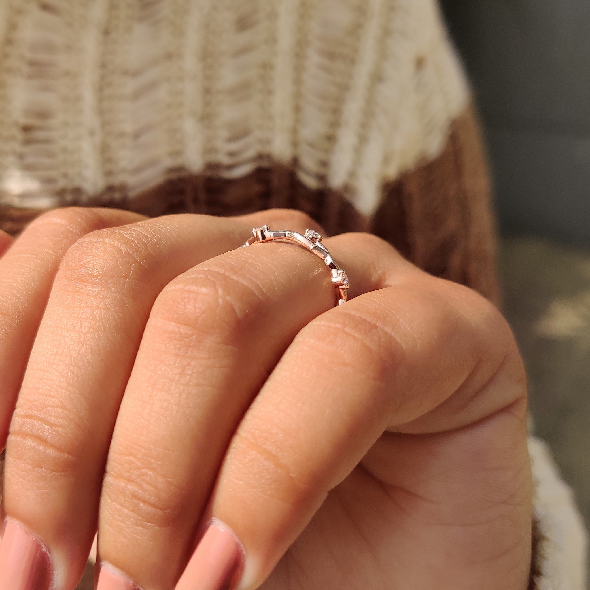 Handmade jewelry wedding band with nature inspired three stone and twisted shank.
