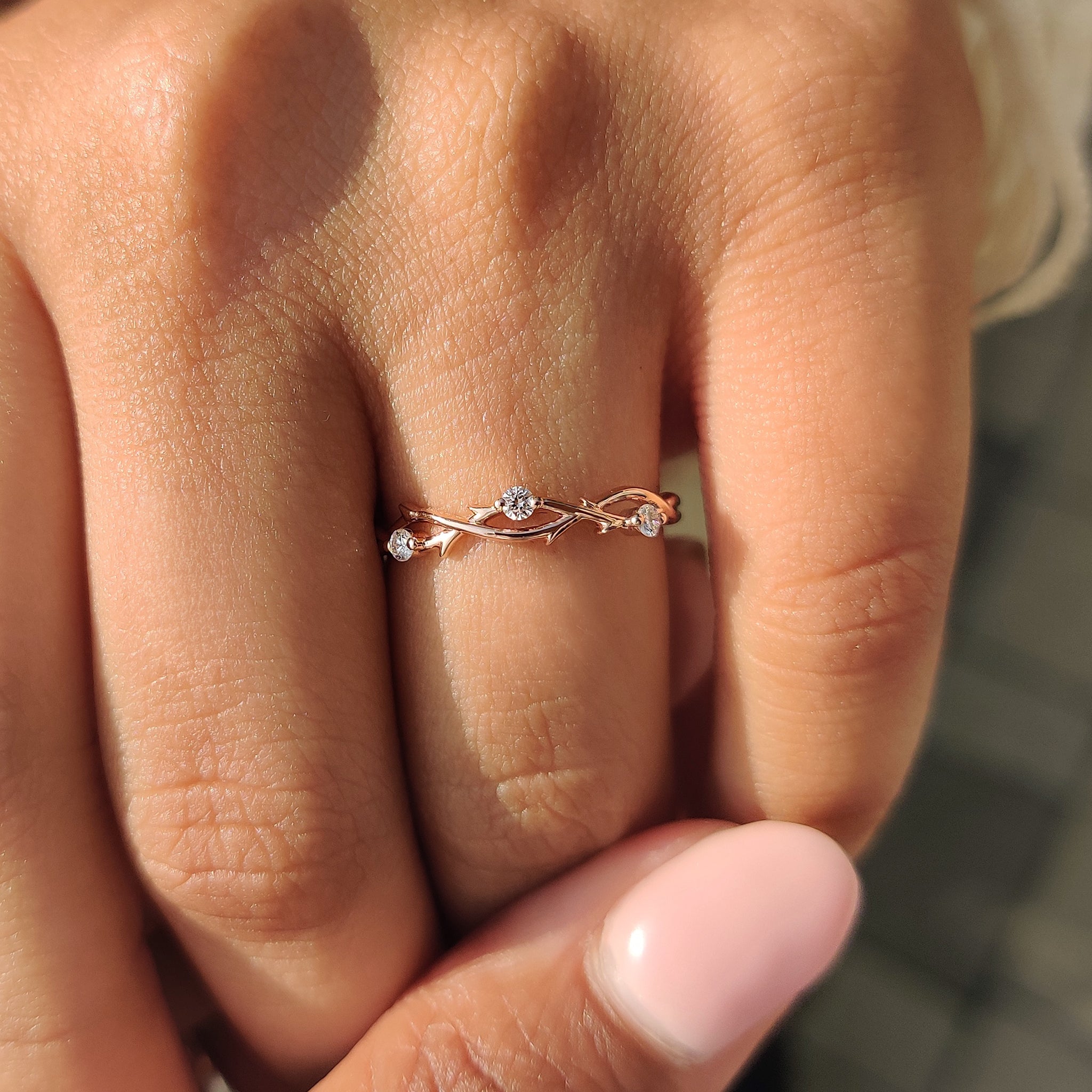 Custom wedding band with twisted shank and lab grown round cut diamonds.
