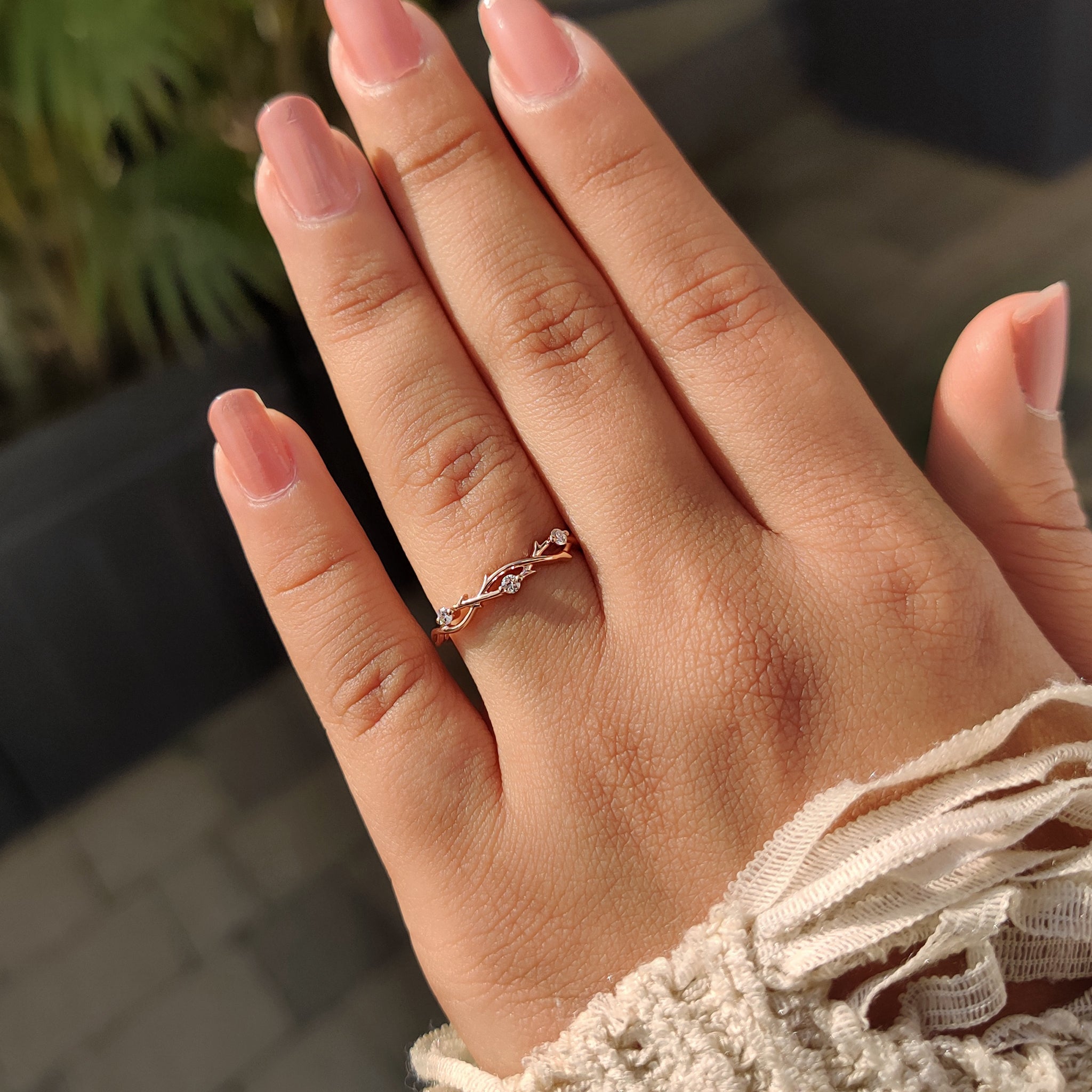 Buy wedding band with round cut diamonds, twisted shank, and rose gold band.
