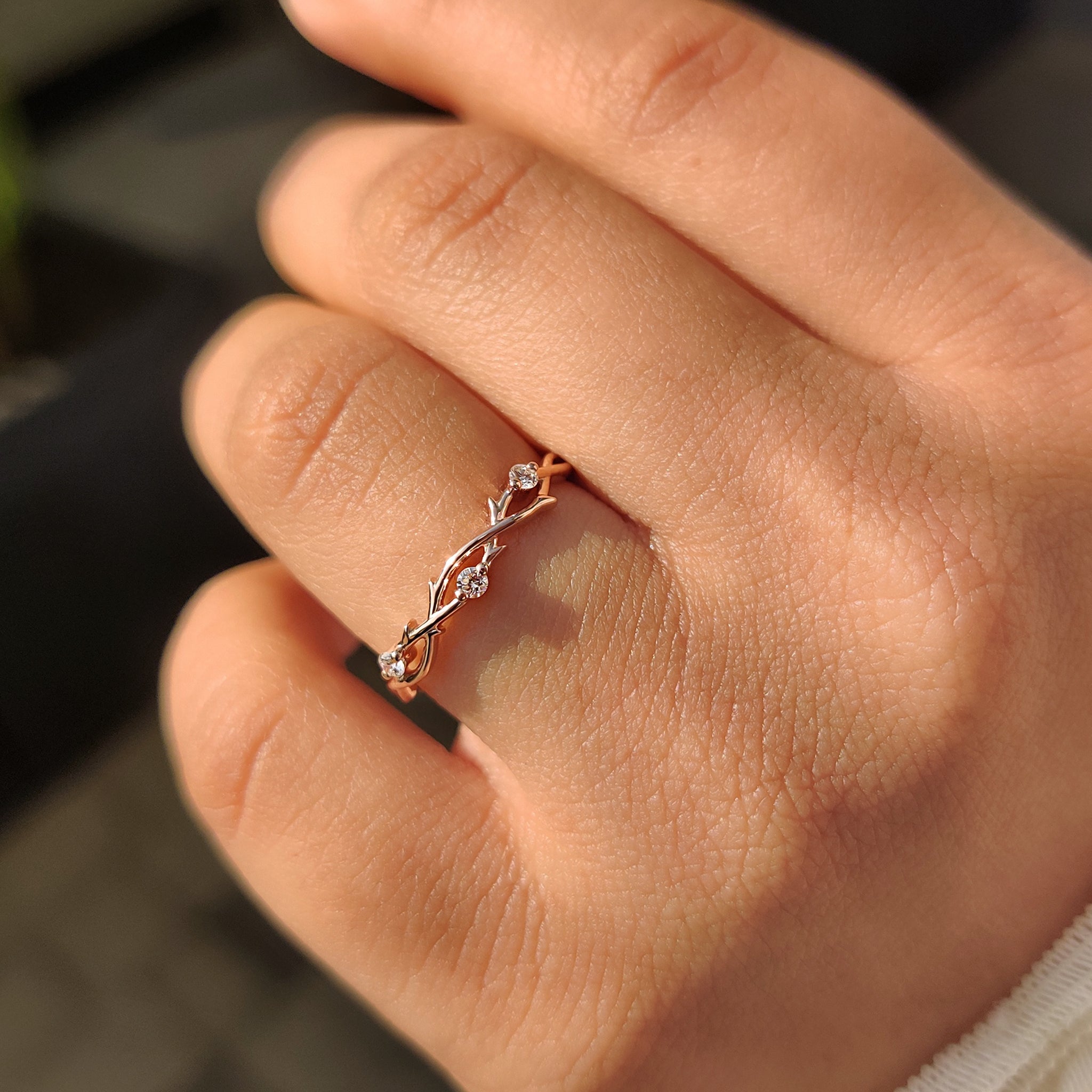 Carat diamonds wedding band with nature inspired design and three stone layout.
