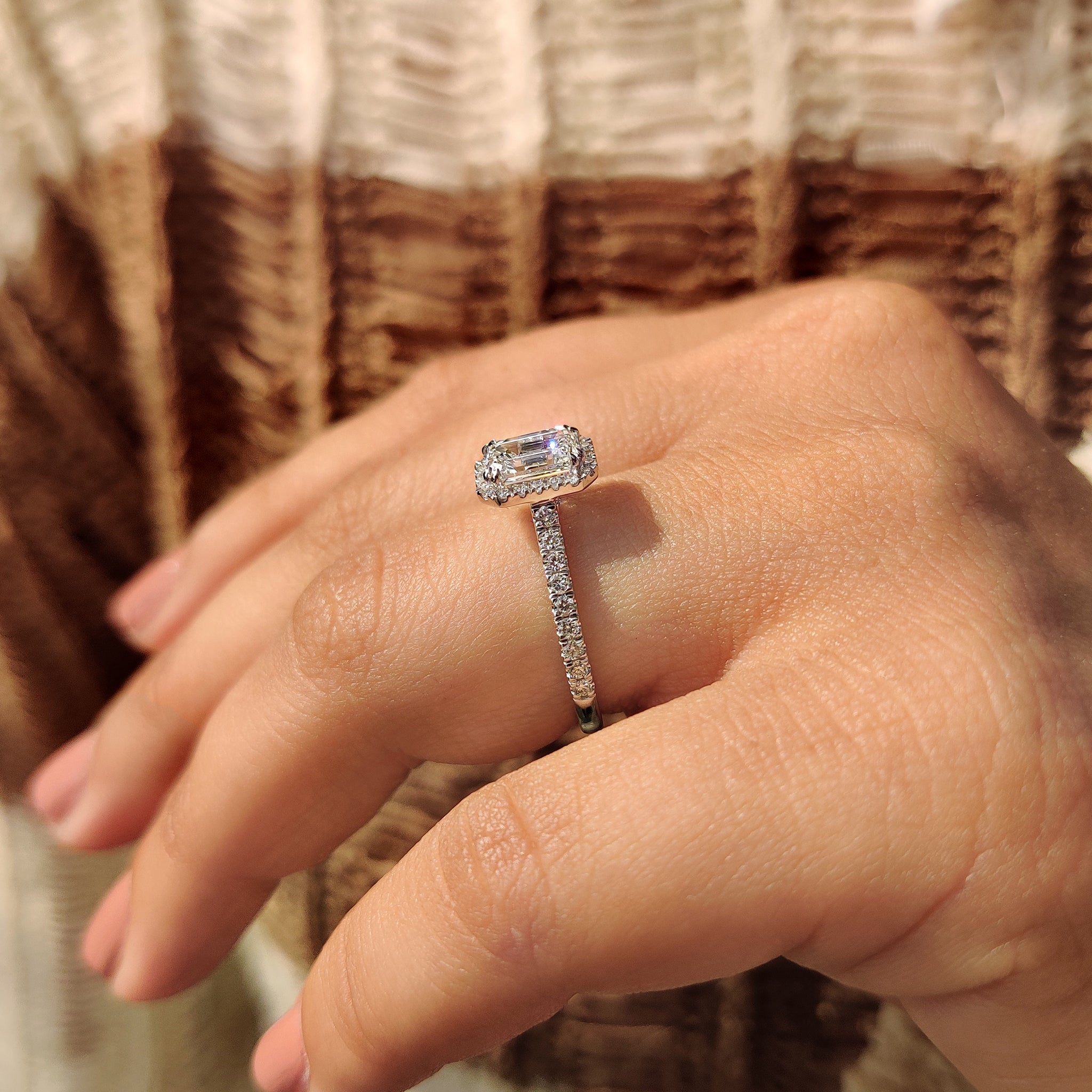 Double claw prong emerald cut diamond ring
