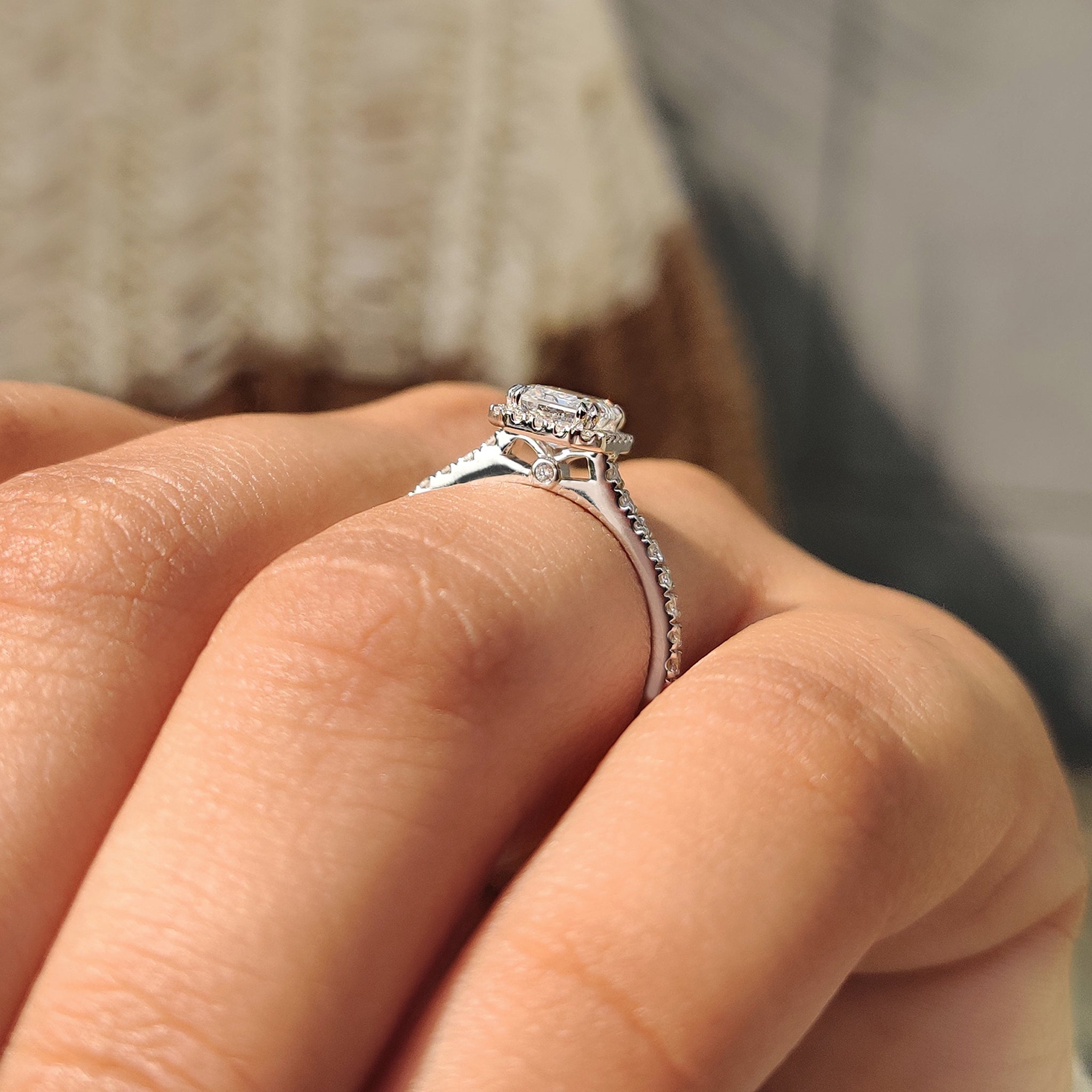 Round cut halo setting emerald engagement ring
