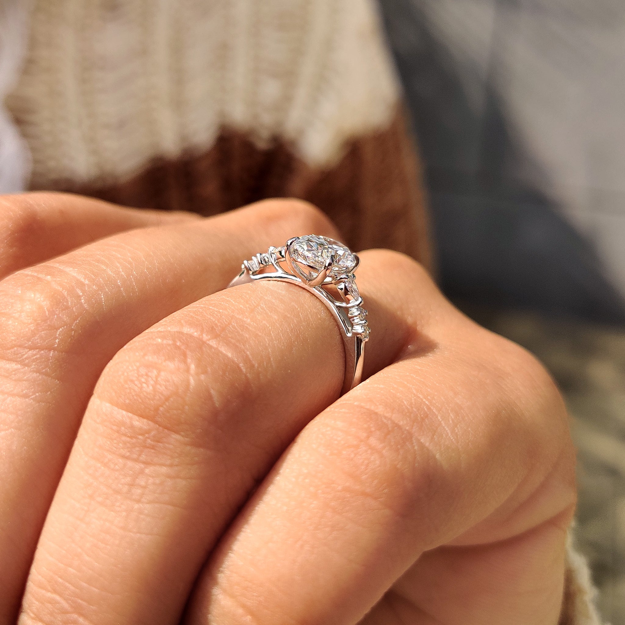 Four claw prong oval diamond ring
