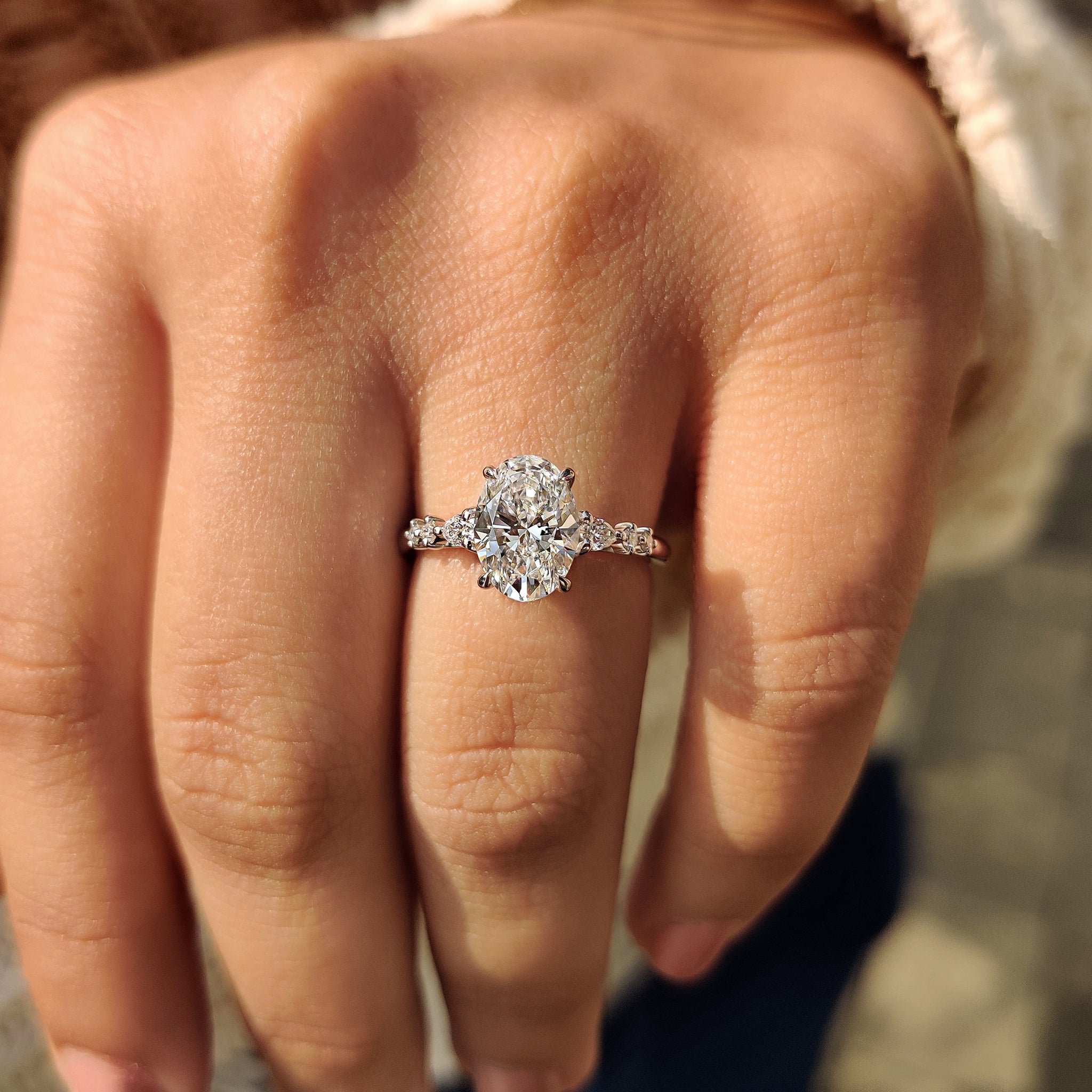 Cathedral setting oval engagement ring
