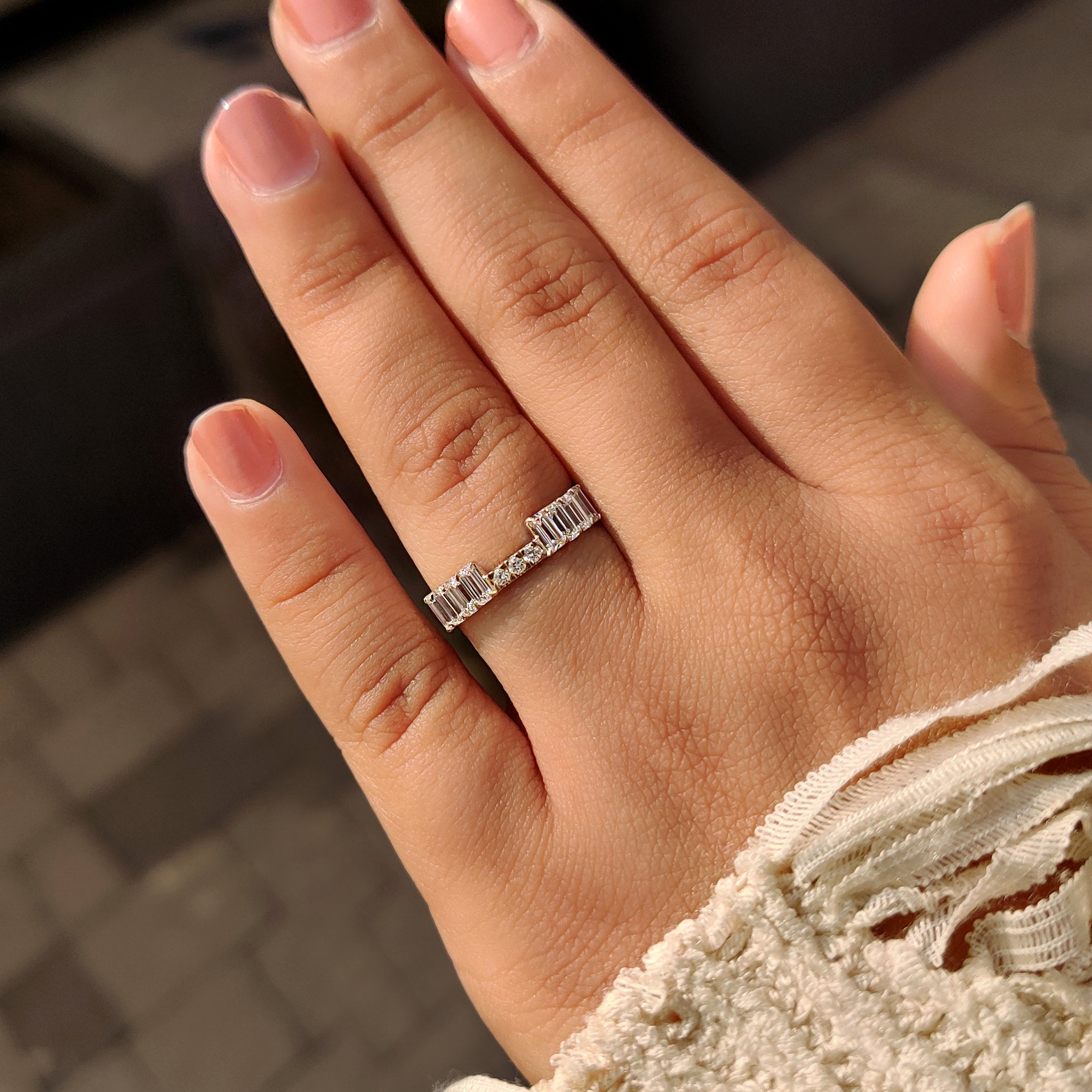 Carat diamonds inspired stackable wedding band in half eternity style.
